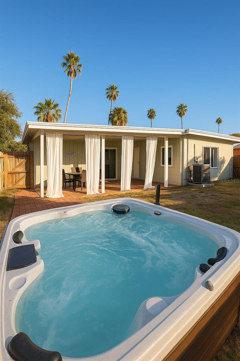 FULLY FURNITURE 3-bedroom, 2-bath home, feature comfortable queen-size beds, elegant décor, and spacious closets.
The third bedroom includes a twin-over-twin bunk bed, 
Modern open kitchen showcases a stylish backsplash, quartz countertops, stainless-steel appliances, and a convenient breakfast bar.
A dining area for six and a cozy living room with smart TV create the perfect space for gathering and entertainment.
Washer and dryer included for added convenience.
Step outside to enjoy a spacious backyard with a beautiful terrace, outdoor sitting area, and lush green lawn—ideal for relaxing or spending quality time with loved ones.
Indulge in your own private jacuzzi, unwind under the sun, and enjoy the peaceful atmosphere.
Available for short-term or monthly stays, this modern residence offers everything you need for an unforgettable stay near Downtown St. Petersburg.Located in a quiet and welcoming neighborhood, just minutes from vibrant Downtown St. Petersburg, the St. Pete Pier, local restaurants, art galleries, and coffee shops. A short drive will take you to the award-winning Gulf beaches such as St. Pete Beach, Treasure Island, and Clearwater Beach. The home is also conveniently located about 30 minutes from Tampa International Airport, making it perfect for travelers flying in.
This property is ideal for families, couples, or professionals seeking a stylish and peaceful retreat close to everything St. Petersburg.
Enjoy a stay where comfort, design, and location come together to create an unforgettable experience.