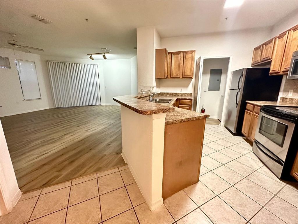 Photo of 6157 Metrowest Boulevard #208, Orlando, FL 32835 (MLS # O6387525)