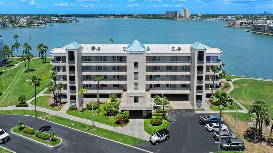 One or more photo(s) has been virtually staged. Welcome home to a condo with lots of potential in Coral Pointe at Harbourside! This 2-bedroom, 2-bathroom third-floor unit with an office/den offers fantastic views of Boca Ciega Bay. Relax with your coffee and watch a spectacular sunrise while dolphins, manatees, and seabirds drift by. Inside, you’ll find the kitchen featuring solid granite countertops, an eat-in area, and a breakfast bar, all flowing into a spacious living and dining room combo that opens to the water view. In fact there are a few rooms with great water views. Not to mention a spacious balcony. The primary bedroom also overlooks the bay and features an ensuite bath and walk-in closet. Natural sunlight fills the condo, with stunning views in every direction. Additional highlights include a stackable washer and dryer, hurricane shutters, a brand new roof in 2025! The unit also comes with assigned under-building parking (#146) and a private storage closet (#305) for added convenience. Life at Harbourside includes access to six sparkling swimming pools, a relaxing spa, five tennis courts, two pickleball courts, two fitness centers, a scenic 1.5-mile waterfront walking trail, and an 86-slip marina with slips available for sale or rent. There are two kayak storage areas, three car wash stations, and two EV charging stations. Residents also enjoy shuffleboard courts, outdoor gas grills, and a vibrant clubhouse featuring a ballroom, billiards, game and card rooms, a woodworking shop, a library, and more. Just a short drive to award-winning St. Pete Beach and vibrant downtown St. Petersburg. Call to schedule your private showing today. You won’t be disappointed.
