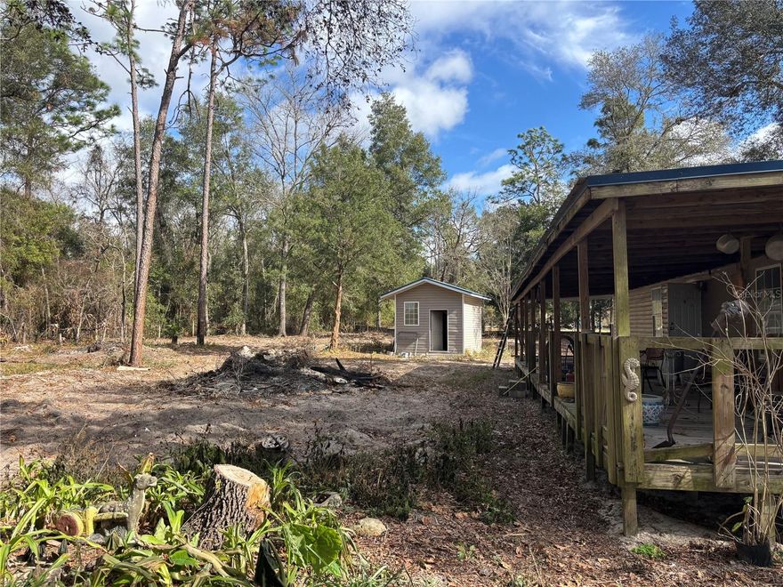 OVERSIZED FENCED CORNER LOT - This 1 acre gated lot offers all the open air natural beauty one could ever want with a 2 bed 2 bath 1200 sqft house, and 2 sheds included. Enjoy the best of both worlds - Serene country living with 25 miles distance to coastal pleasure. Horseshoe Beach is approximately 24 miles (30 minutes) away—one of Florida’s most peaceful Gulf towns, perfect for fishing, kayaking, and unforgettable sunset views over the Gulf of Mexico. This charming Old Town retreat is ideally located near North Florida’s most celebrated water destinations. Enjoy the area’s renowned rivers, springs, and coastal escapes right at your doorstep. Fanning Springs State Park is a quick 12-mile (15-minute) drive, inviting you to swim in crystal-clear waters, spot manatees, and enjoy family-friendly recreation. Manatee Springs State Park lies just 18 miles (22 minutes) away, featuring scenic boardwalk trails, diving access, and year-round natural beauty. The entire perimeter of the property is lined with trees. Imagine your mini-farm, AirBnB retreat, or simply a country oasis away from everything just for YOU! The wealth is in the LAND!  Schedule Your exclusive tour Today!