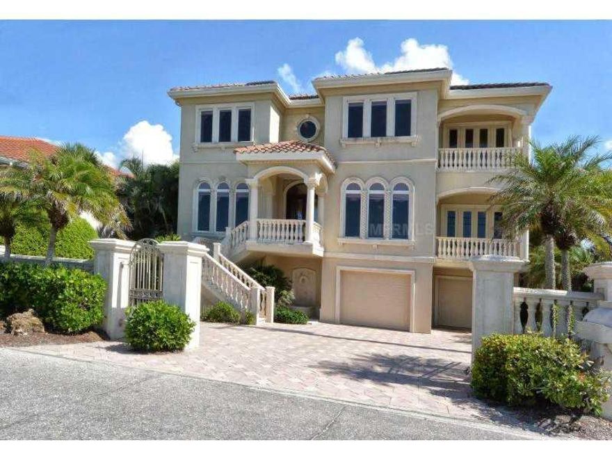 Exceptional Gulf to Bay property with great water views from every room in the house. Custom blt. in 2001 with the best of finishes and meticulously maintained.Spacious rooms on main level with 11.5` ceilings and large covered porch with postcard views of bay. Brazilian cherry and travertine floors, 3 stop elevator,cook`s kitchen with Dacor and Sub-zero, custom cabinetry and granite counters. Large library/study with Gulf views and custom cherry built-ins. Sumptious master suite with private porch, tray ceiling and well designed bath. Separate exercise room with wet bar,wine fridge and million $Gulf views. Cabana with electric/water on private beach, trex dune walkover, resort style pool, summer kitchen & dock with 30k boat lift. Anderson windows and doors with impact glass up to current code. Built on pilings to a depth of 25`. A beautiful and well designed Casey Key home ready for immediate occupancy and enjoyment. Upscale but casual beachfront living.Casey Key is an eight mile long barrier island, home to many Florida wildlife species as well as one of the few beachfront communities in Florida with private beaches all along its shoreline.