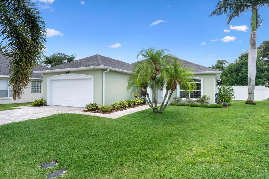 This wonderful 3-bedroom, 2-bath home is sited in the desirable community of Audubon Place just a short walk to the Audubon Nature trail. Upon arrival, you’ll be greeted by a charming covered entrance, a paved walkway, and a lushly landscaped yard. This desirable split bedroom floor plan offers high ceilings throughout, enhancing the spacious feel of the home. The living room is warm and inviting with wood laminate flooring and a glass door that extends your living space into the screened-in lanai. The remodeled kitchen features custom cabinetry with crown molding, oil-rubbed bronze hardware, soft-close hinges, and undermount lighting. The breakfast bar, adorned with pendant lighting and granite countertops, adds both style and functionality. The upgraded appliance suite includes a gas range and a pantry with pull-out shelves, perfect for all your cooking needs. A charming breakfast nook overlooks the front yard, providing a cozy spot for morning coffee. The primary bedroom is a true retreat, offering views of the back patio and a walk-in closet. The en-suite bath, accessed through a pocket door, continues the custom cabinetry theme with dual sinks, bronze hardware, soft-close hinges, and granite countertops. The seated walk-in shower features decorative listello tile surround and French glass door access. Custom upgrades extend to the guest bathroom as well. For outdoor relaxation, this property won't disappoint. The lovely screened lanai with a ceiling fan and patio provides an ideal space for entertaining. The picturesque, fenced-in backyard features an array of landscape plantings, creating a serene environment. Other amenities include Two well-appointed guest bedrooms, Solid surface flooring throughout, Glass storm entrance door with transom window and smart lock access, Gas water heater 2019, Washer and gas dryer, Pull-down attic stairs, In-wall pest system, Gutters, Irrigation system with shallow well, New roof (2022), HVAC system (2018), Water Softener System, Amcrest smart home doorbell with cameras, Double-pane windows, Paved driveway, Keyless garage door pad, Utility sink in garage, 2-car garage with workbench, garage door opener, and keyless entry pad. This beautiful property is located in an established community on a cul-de-sac, centrally located close to shopping, schools, restaurants, and Legoland. This home is truly a gem, offering comfort, style, and convenience in one perfect package.
