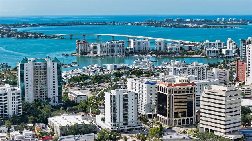 Boutique downtown living takes on a new level of sophistication at Sansara, an exclusive 10-story building with only 17 private residences in one of Sarasota’s most walkable and vibrant locations. Just moments from Burns Court’s cafés, eclectic boutiques, galleries, and the Sarasota Bayfront, this address offers both convenience and a sense of quiet retreat. Residence 302 captures a peaceful, elevated perspective with views of tropical greenery, the glistening pool, and the city skyline beyond. Encompassing nearly 2,300 SF, the home is thoughtfully designed with expansive walls of glass that invite in abundant natural light, rich hardwood flooring, tailored cabinetry, elevated lighting selections, and automated window treatments. The kitchen serves as a stylish centerpiece, appointed with sleek European cabinetry, quartz countertops, premium Bosch appliances plus wine refrigerator, and a spacious island ideal for gathering. The open-concept living area extends effortlessly to a private terrace; an inviting space to start the day or relax in the evening while overlooking the pool below. A well-designed split floor plan provides both comfort and privacy. The primary suite is a serene escape with terrace access, custom walk-in closet, and a spa-like bath featuring dual vanities and a walk-in shower. Two additional guest suites, one perfectly suited for a home office or den, offer versatility for a variety of lifestyles. Additional highlights include impact-rated windows and 10-foot disappearing sliders, multiple outdoor spaces, custom dry bar for effortless entertaining, generously sized laundry room with storage, customized closets, and secure elevator access. Residents of Sansara enjoy a collection of boutique amenities, including a heated saltwater pool and spa, cabana areas, fire pit lounge, outdoor kitchen and grill, a fitness studio, and secure building access. All designed to complement a relaxed yet refined downtown lifestyle.