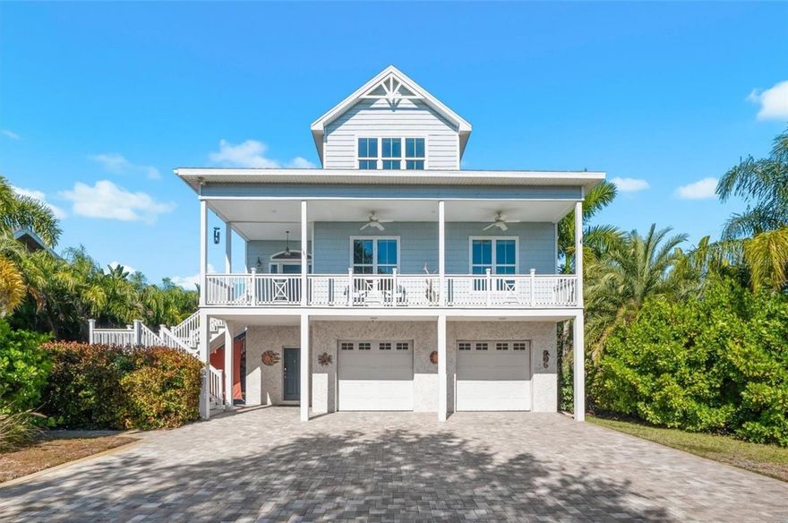 Discover this exceptional 4-bedroom, 3.5-bath luxury estate with screen enclosed private fiberglass pool, nestled within the gated waterfront community of Mariner Village. Built in 2016 to meet the newest hurricane standards, this elevated three-story home blends elegant design, modern functionality, and stunning western water views. A private boat slip at the community marina is available for lease, offering convenient deep-water access just minutes from the Gulf of Mexico.

Set on an oversized lot surrounded by lush tropical landscaping, this residence makes a striking impression with its extensive paver driveway, manicured grounds, and sophisticated architectural design.

Inside, a soaring foyer welcomes you into a bright and open living space featuring a gas fireplace, custom built-ins, and sliding glass doors that frame tranquil waterfront views. The gourmet kitchen showcases leathered granite countertops, a large island, soft-close cabinetry, walk-in pantry, beverage refrigerator, and premium stainless-steel appliances. The layout flows seamlessly into the dining area and covered patio perfect for entertaining or relaxed evenings at home.

The main level includes a flexible private office (optional 4th bedroom), an ensuite guest room, and a convenient laundry room. Upstairs, the primary suite offers a luxurious retreat with a custom walk-in closet, freestanding soaking tub, walk-in shower, dual vanities, and a private balcony - viewpoints of the Gulf of Mexico. From here, a spiral staircase leads to a rooftop viewing platform offering panoramic Gulf views and breathtaking sunsets.

The lower level features approximately 740 square feet of additional finished space (not included in main living area), currently used as a recreation area with ping pong table, home theater, and gym. Step outdoors to enjoy a resort-style screened lanai with saltwater pool, standalone hot tub, and plenty of space for lounging or play on an extensive paver patio.

Additional highlights include a two-car garage with tall ceilings and extra storage, multiple walk-in attics with spray foam insulation, hurricane-rated features, and elevator-ready construction. Residents enjoy a guarded gate, deed restrictions, and access to boating, kayaking, and fishing just steps from home.

Located minutes from Sunset Beach, Fred Howard Park, the Pinellas Trail, and historic downtown Tarpon Springs, this exceptional home offers an elevated coastal lifestyle, combining luxury, flexibility, and waterfront living at its finest.