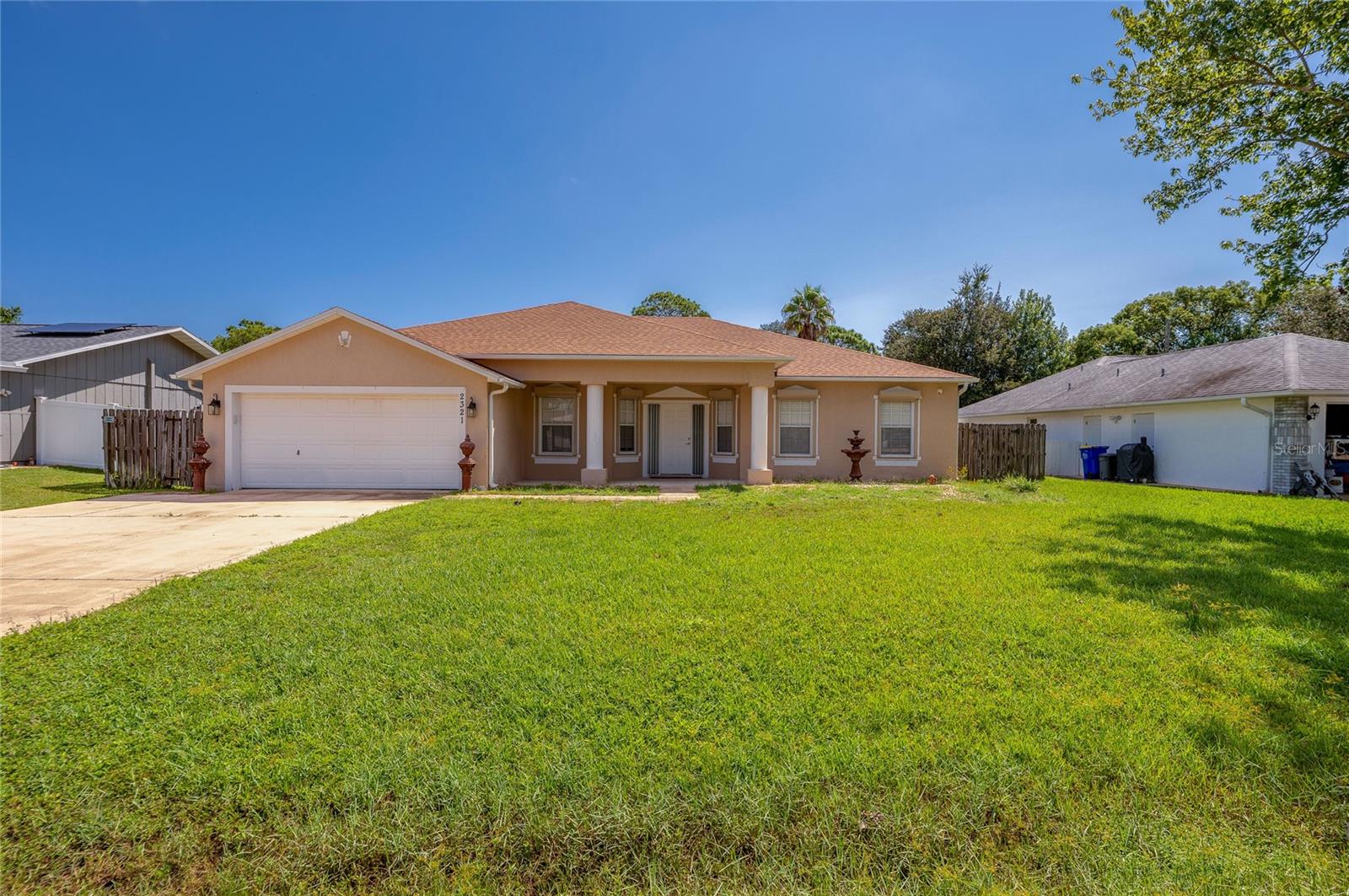 Concrete block 4/2 spacious fenced home with a pool. New roof in 2024. Large foyer opens up to a sitting room to the right and a dining room on the left; adjacent to the large kitchen. Kitchen has light cabinetry with beautiful granite counter tops. Kitchen features a large pantry/storage area. Dining room is a nice size for formal dining, and dinette area off the kitchen offers a smaller space to dine. Very large, open living room opens up to a large covered lanai that leads to the pool. Three bedrooms are at the south side of the house and are close to the large bathroom with tub that also leads to the patio and pool area. The primary bedroom is spacious and also has sliders leading to the covered patio. Primary bathroom is very spacious with a nice soaking tub and nearby shower. Very spacious walk-in closet. The 2 car garage recently had the floor painted with "shark like" coating and is pristine. This house has many perks; space, entertainment options, as well as covered outdoor lanai and lovely pool area. NO HOA.
Measurements are deemed approximate. Refrigerator does not convey.