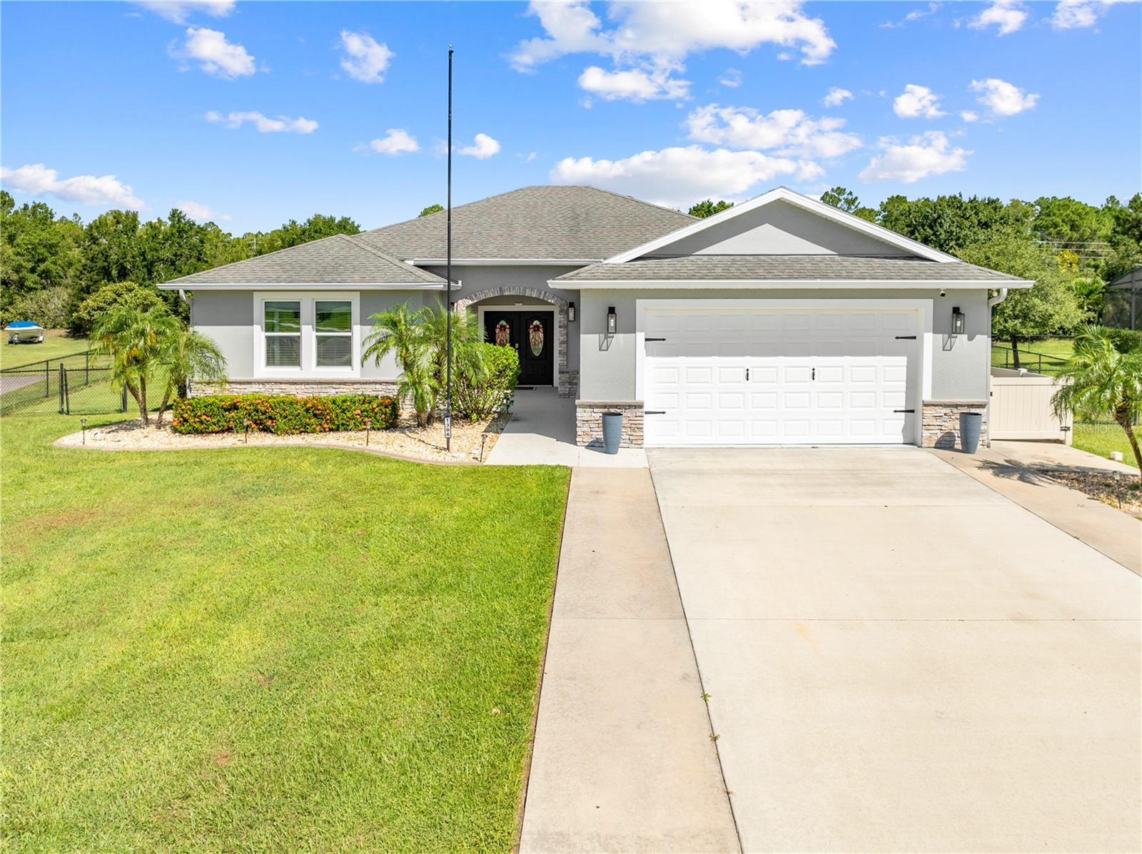 NEW LISTING IN THE DESIRABLE NOVA BAY COMMUNITY! THIS BEAUTIFULLY MAINTAINED HOME OFFERS 3 BEDROOMS, 2 BATHROOMS, PLUS A VERSATILE DEN/OFFICE THAT CAN SERVE AS A 4TH BEDROOM. WITH AN OPEN FLOOR PLAN AND LUXURY VINYL WOOD FLOORS THROUGHOUT, THIS PROPERTY BLENDS COMFORT, STYLE, AND FUNCTIONALITY. THE SPACIOUS KITCHEN IS A SHOWSTOPPER WITH WOOD CABINETS, GRANITE COUNTERTOPS,GLASS TILE BACKSPLASH AND STAINLESS STEEL APPLIANCES, PERFECT FOR FAMILY MEALS OR ENTERTAINING. ENJOY THE LARGE LIVINGROOM AND DINING ROOM, CREATING THE IDEAL SPACE FOR GATHERINGS. THE PRIMARY SUITE IS A PRIVATE RETREAT, FEATURING A CUSTOM FEATURE WALL, TONS OF NATURAL LIGHT, DOUBLE SINKS WITH A LARGE VANITY FOR STORAGE, A TILED SHOWER, AND BUILT-IN CUSTOM CLOSETS. THE HOME ALSO BOASTS A LARGE INSIDE LAUNDRY ROOM WITH BUILT-IN CABINETS AND A LAUNDRY SINK. DROP ZONE RIGHT INSIDE THE GARAGE DOOR. STEP OUTSIDE TO ENJOY THE INCREDIBLE .52-ACRE FENCED BACKYARD. ENTERTAIN ON THE EXPANSIVE PAVER PATIO WITH A BUILT-IN FIREPIT AND RETAINING WALL, WALK ALONG THE PAVER WALKWAY TO THE STORAGE SHED, AND ENJOY THE CUSTOM PLAY SET AND SAND PIT! ALL INCLUDED WITH THE HOME. THE PROPERTY IS ACCENTED BY TASTEFUL LANDSCAPING WITH CONCRETE COPING AROUND EVERY FLOWER BED, CREATING BOTH BEAUTY AND LOW MAINTENANCE. ADDITIONAL HIGHLIGHTS INCLUDE:OVERSIZED 2-CAR GARAGE, UPDATED EXTERIOR & INTERIOR PAINT (2023) NEW AC (2023) AND STACKED STONE EXTERIOR! THIS HOME IS TRULY MOVE-IN READY AND OFFERS EVERYTHING YOU’VE BEEN LOOKING FOR. MODERN UPGRADES, THOUGHTFUL DESIGN, AND A SPACIOUS OUTDOOR OASIS. DON’T MISS YOUR CHANCE TO OWN THIS GEM IN NOVA BAY. CLOSE ENOUGH TO TOWN AND THE ST CLOUD LAKEFRONT, BUT FAR ENOUGH OUT THAT YOU CAN ENJOY THE PEACE AND QUIET OF LIVING IN THE COUNTRY. CALL TODAY TO SEE THE GEM!!!!