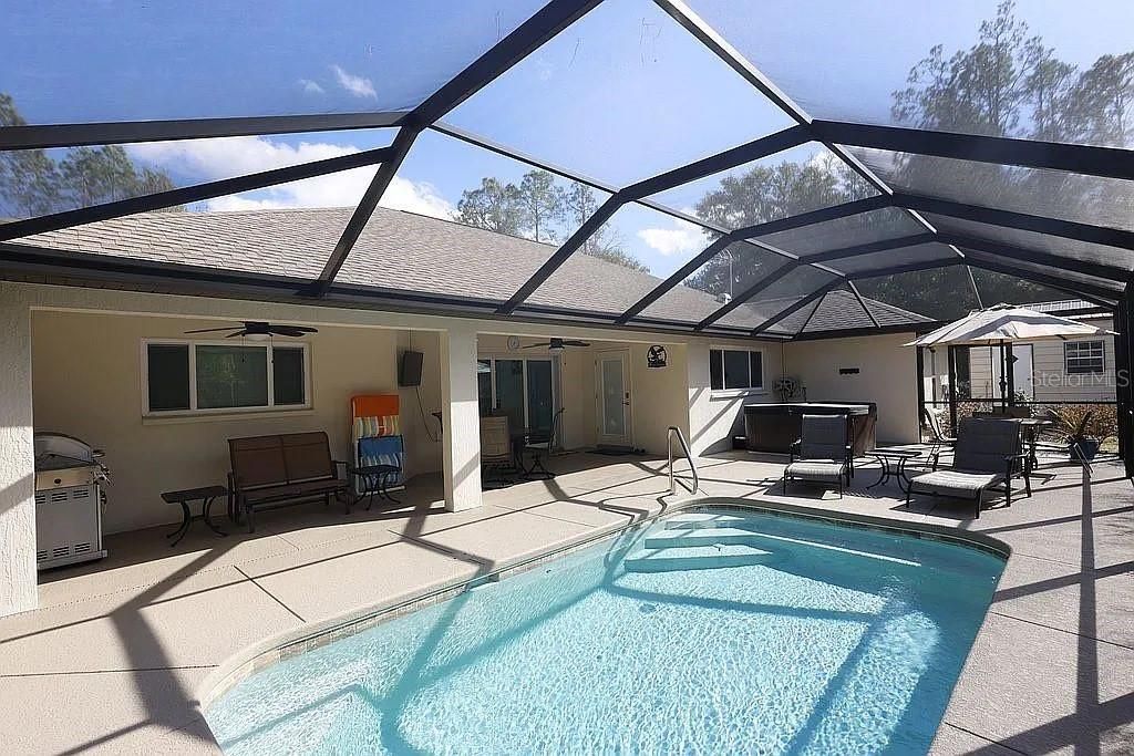 Photo of 21949 SW 85th Loop, Dunnellon, FL 34431 (MLS # R4910728)