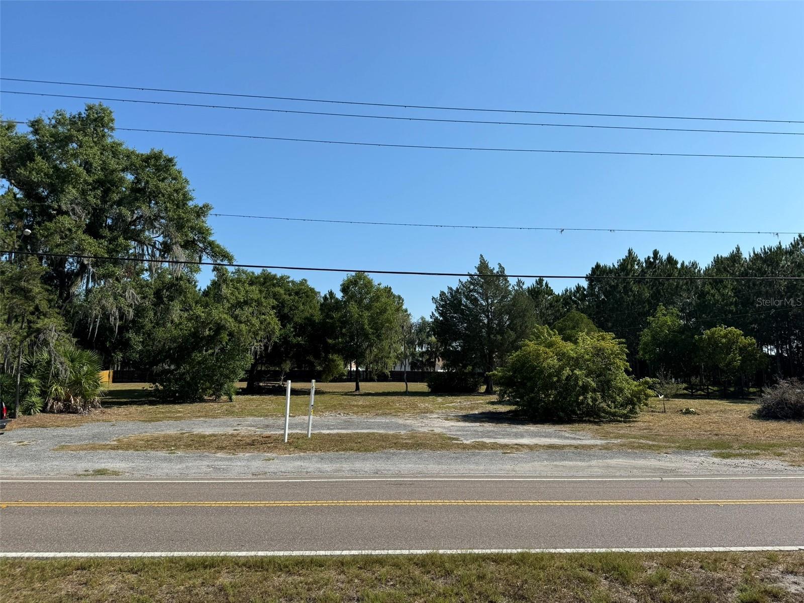 The perfect location for your company HQ, Emergency VET or Medical Clinic, Day Care and more. Commercially zoned land in sought-after Keystone, FL-right in the middle of Tampa Bay's 3 major counties; Hillsborough, Pasco and Pinellas. This nearly 1-acre square-shaped parcel is located in North West Hillsborough's affluent Keystone area, positioning your business within a 25 mile radius to 2.4m consumers. The zoning is straight CN, so there are no obscure PD restrictions in place-very hard to find in Keystone. The owner has an active county-approved Site Plan with ROW fees paid and permits to break ground in place, including architectural renderings of a 5,000 sq. ft building. Traffic counts from 2024 are more than 7,177 vehicles /day average and climbing. This area of Hillsborough County has one of the highest percapita household income and family net worth than any other zip code demo in the county. This parcel is one of the only usable commercial sites in the surrounding area and includes prior 2APS wet zoning. Medical, Office, Retail, restaurant, market and a host of use options are allowed in CN. The property is located in the rural service area, so the property will be serviced by private well and septic.