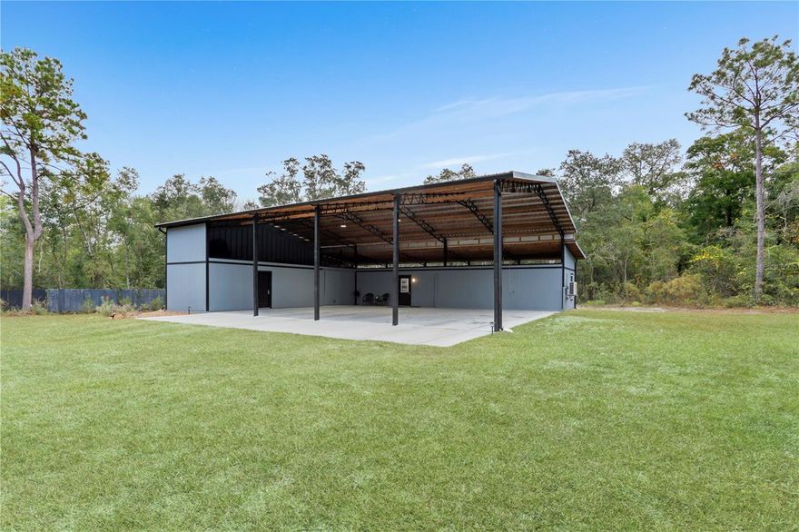 This 9.61-acre property partly cleared is perfect for those looking for a getaway in the country, to park your RV while building a site-built home or while getting ready to put an MH on it, if the county allows. The 2022 pole barn is 60x54 (3240 sq ft) with 2x6 & 6x6 poles, the patio is 12x60, the approach is 12x48, The 1Br/1.5BA with, laundry room, and kitchen. The "barn-dominium" features 4 big bays for parking with a storage room (34x12) with a barn door, ramp, loft access & 1/2 bath access into the house, the concrete pad is set up for a 3rd way-reinforced lift. 650 feet Lime rock driveway with gate, 400 AMP electric service, RV hook up with 50 AMP, 2022 Metal roof, Kitchen features all new appliances with refrigerator, conventional/air fry cooktop oven, microwave, dishwasher, pantry & solid wood kitchen table & stools, butcher block counters with plenty of cabinets. The home features fans in the living room & bedroom, cellular shades, recess lighting throughout, exhaust fan in both bathrooms with a built-in heater & integrated led lights, 3 mini splits (laundry room, living room & bedroom) large laundry room/office with its own mini split, sink, washer & dryer. Double Pane windows throughout the home and the porch features an outside shower, outside lighting & outlets. NO HOA OR DEED RESTRICTIONS.