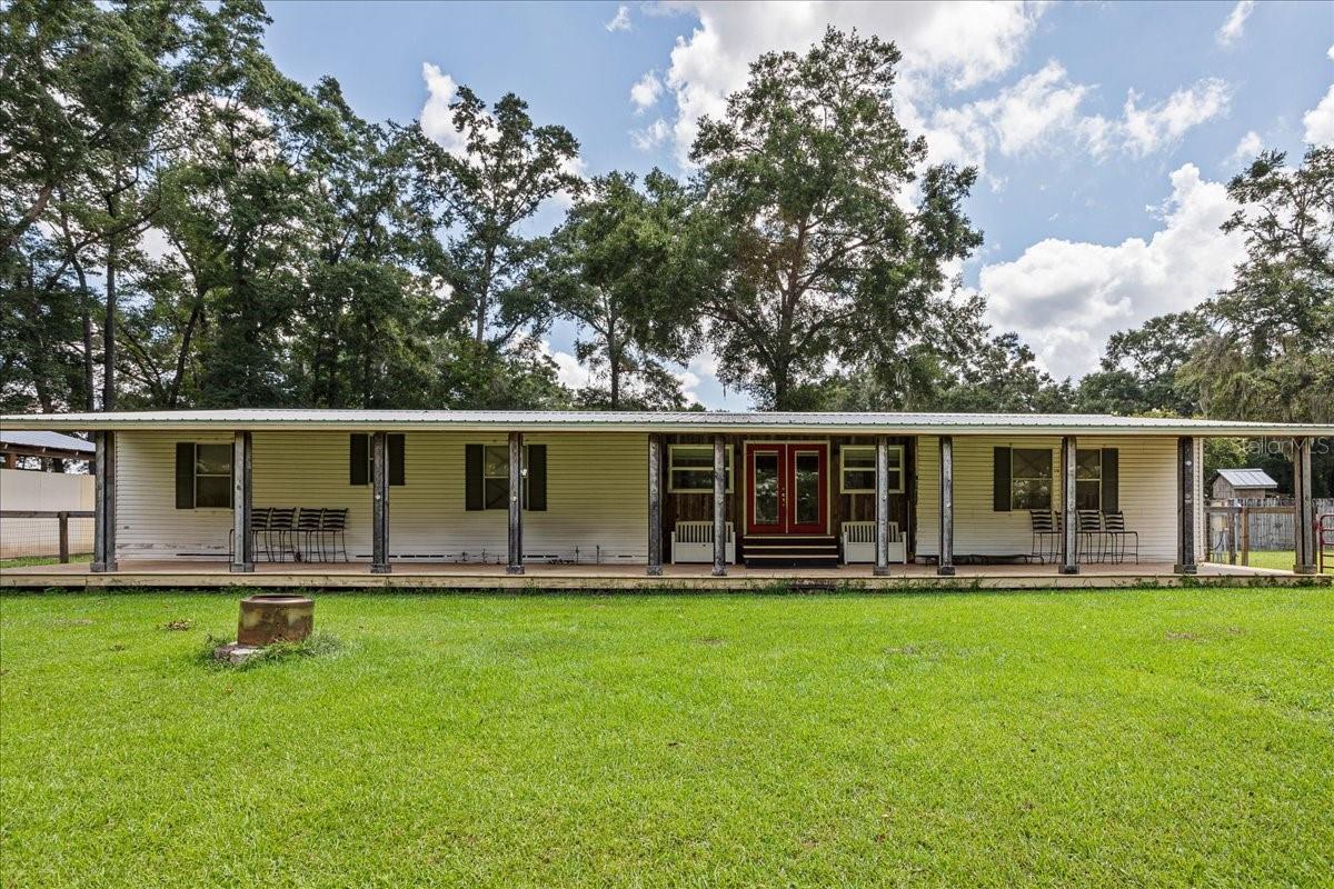 Equestrian Dream Property on 6 Acres – Triplewide Home, Barns & Blueberries!
Bring your horses and your dreams to this beautifully maintained triplewide mobile home on a picturesque 6-acre spread designed for both comfortable living and serious equestrian use. Located in a peaceful rural setting, this property is fully fenced and cross-fenced, ready for livestock, gardening, or simply enjoying nature.
The home features a metal roof, an open and airy floor plan, a recently renovated kitchen, two separate living areas, and an inside utility room for everyday ease plus a wood burning stove for a few cooler days in the winter! Step outside and you'll be greeted by grounds that are manicured like a park, dotted with olive trees and a thriving orchard of 85 producing blueberry bushes—a true haven for the hobby farmer or homesteader.
For the horse enthusiast, the property boasts a 60’ round pen, plus a 150' x 200' riding arena with lighting, three separate pastures, a 24' x 24' shade barn and paddock, a center aisle barn with 4 stalls, a separate hay barn that can hold 28 rolls of hay! All this plus an air conditioned feed and tack room and horse-ready no-climb fencing!
Additional highlights include a 24’ x 40’ open workshop with 220 amp power, perfect for tools, equipment, or weekend projects plus a tying pole and water close to the barn. I almost forgot to mention that San Felasco Preserve is 10 minutes away with 6,000 acres of intersecting trails to ride on- Another hidden gem!
This is the rare property that offers livability, functionality, and income-producing potential all in one. Whether you’re looking to bring your horses, have livestock, garden, farm, or simply enjoy the tranquility of the land — this place is ready for you. Schedule your tour today!