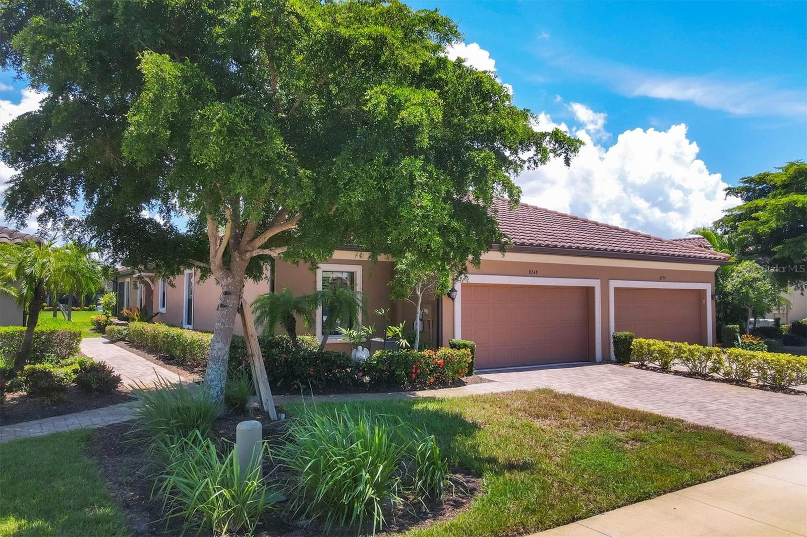 Situated in the highly desirable Esplanade by Siesta Key community, this maintenance-free villa is just minutes away from downtown Sarasota and the pristine, crystal-sand beaches of Siesta Key. Enjoy breathtaking water views from multiple vantage points within the villa. The living room opens up to an expansive lake view that creates a serene atmosphere. The kitchen is equipped with generous granite counters, making it both functional and stylish. This villa offers two en suite bedrooms, a third bedroom, and an office or den that can also serve as an additional guest room. The primary bedroom boasts impressive lake views, an en suite bathroom with double sinks, a spacious shower, and a large walk-in closet. The den provides a quiet, inviting space for work or relaxation. Step onto the extended lanai and experience the beauty of lush foliage and shimmering lake views. Whether enjoying a morning cup of coffee or a sunset dinner, the lanai offers the perfect setting for peaceful outdoor living. The villa has been "lightly lived-in," as the owners only reside here for short periods each year. Upgrades include Plantation shutters throughout, ceiling fans, granite countertops in the kitchen and bathrooms, custom cabinets in the laundry room, hurricane shutters, lanai pre-wired and plumbed for a summer kitchen, epoxy flooring in the garage, gutters, and a hurricane-resistant garage door. Esplanade by Siesta Key offers a variety of first-class amenities, including an elegant Amenity Center, pool and spa, a fully equipped fitness room, pickle ball court, Har-Tru tennis court, and a dog park. Residents can participate in a full menu of social activities and enjoy the benefits of no CDD fees and no hurricane concerns. This is a rare opportunity to experience Sarasota living at its finest. Furniture is optional.