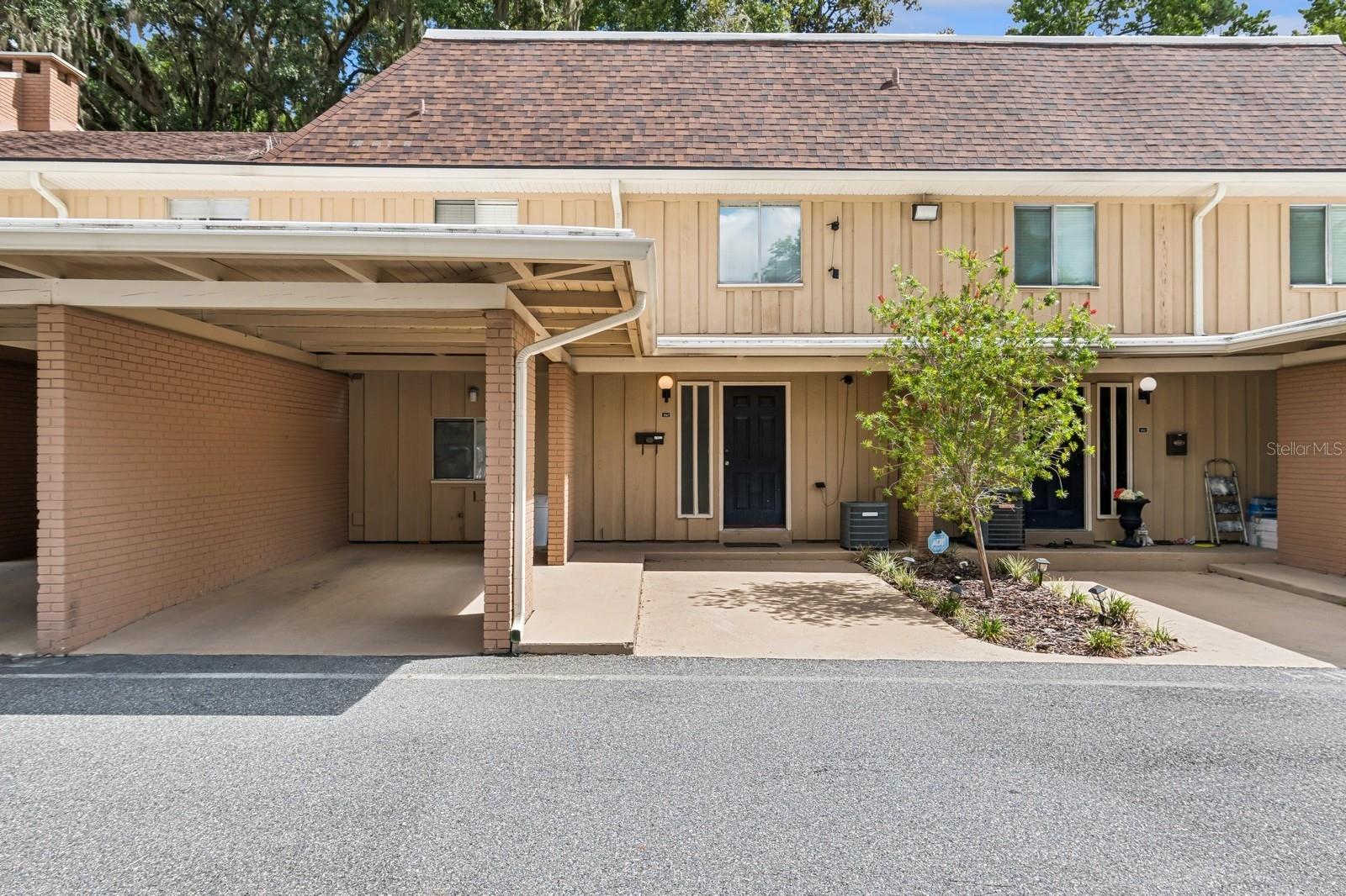 Don't miss out on this exceptional opportunity to own a spacious 3-bedroom, 2.5-bathroom condominium in Hawthorne Reserve! This unit is move-in ready, featuring stunning LVP and tile flooring throughout—say goodbye to carpet! The gorgeous kitchen boasts stainless steel range and dishwasher and a walk-in pantry, making it a chef's delight. The great room is designed for entertaining, complete with a wood-burning fireplace and dining space. Two sets of sliding doors open onto an oversized back patio that offers beautiful views and extra privacy, creating a perfect outdoor retreat. On the main level, you'll find a well-placed half bathroom for guests. All three bedrooms are located on the second floor, each featuring spacious walk-in closets. The primary bedroom includes a luxurious ensuite bathroom and a private balcony for your personal enjoyment. There are 2 designated parking spaces with one being a covered carport. Take advantage of fantastic community amenities including a clubhouse, fitness center, tennis courts, and a pool. This stunning property is ready for you to make it your own! With its prime location near the University of Florida, Santa Fe College, UF Health, HCA Florida North Florida Hospital, Butler Plaza, and Celebration Point, this opportunity won't last long. Act now—call today to schedule your tour before it’s gone