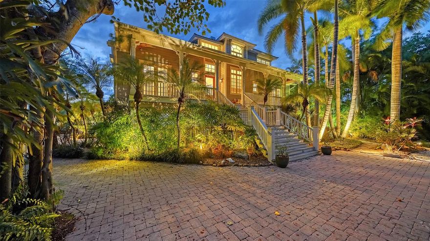 Taking back-up offers! Indulge in the ultimate coastal living experience with this stunning custom-built waterfront home in the Bayou Louise neighborhood on the north end of Siesta Key. The tropical oasis boasts resort-style amenities and 104 feet of boating water, providing direct access to the Gulf of Mexico. You'll love the lush tropical landscaping, tranquil outdoor living spaces, and water views. Enjoy the convenience of being located within the city limits of Sarasota, with easy access to downtown's best restaurants, shopping, and entertainment, and minutes from Siesta Beach and Siesta Village.  This elegant waterfront home features a versatile living space boasting a spacious great room with soaring ceilings, abundant natural light, a limestone fireplace, and gorgeous wide-plank hickory hardwood floors throughout the home, creating casual sophistication. The kitchen is designed for entertaining and features a Viking 6-burner natural gas range, custom cabinetry, stone counters, a breakfast bar, a planning desk, a closet pantry, a butler's pantry, and a beverage bar. The expansive French doors in the great room and dining areas lead to a veranda overlooking the pool and waterway. The main floor has two full bathrooms and a laundry room. There is also a full guest suite featuring two balconies! A third bedroom is currently used as an office and features a built-in desk and a balcony. The generous primary suite boasts a fireplace, window seat, private balcony, and sitting room. The ensuite bath offers a shower, jetted tub, dual sinks, and limestone countertop. Enjoy water views and gulf breezes year-round from the multiple balconies, including an outlook with seating accessed by a spiral staircase to enjoy sunsets with peek-a-boo views of the Gulf of Mexico. Additional features include integrated lighting, security, impact glass, solid-core interior doors, fully engineered pre-wired elevator shaft for future use.  There's abundant storage areas throughout the home, a metal roof and three-car garage.  Look no further than your private dock and boat lift to accommodate small to medium-sized vessels up to 25'. You can also easily launch your kayak right from your backyard. Don't miss out on the opportunity to own this breathtaking waterfront home with all the luxurious amenities you could ever want.