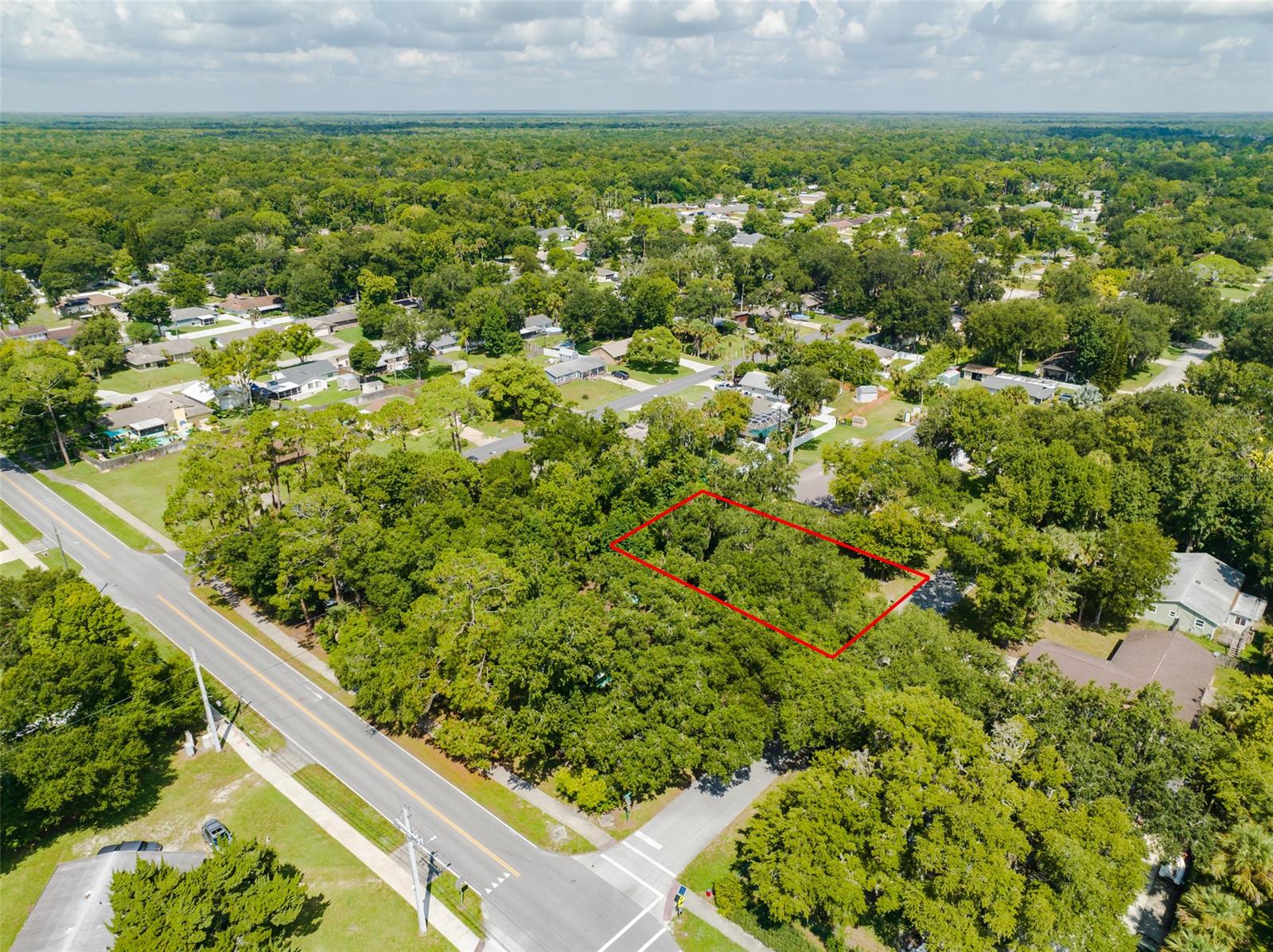 Perfect opportunity to own this large mostly cleared 107 x 125 lot in the Non-HOA community of Florida Shores in Edgewater FL. Build your dream home or an investment home. This property has so much potential! Less than 10 minutes to I-95, 5 minutes from the River, and close proximity to shopping!; Cleared: Partial