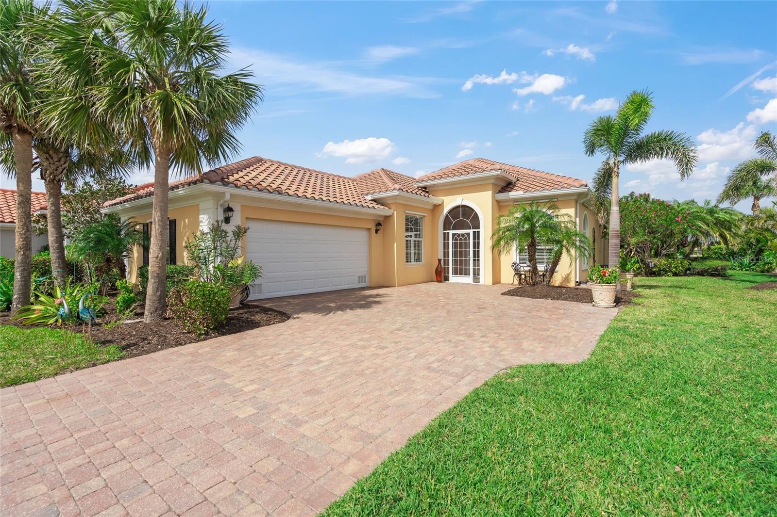 Welcome to your Florida tropical oasis! This beautifully kept 3-bedroom, 3-bathroom home offers luxurious features and thoughtful design, all situated on an extra-wide corner lot. The centerpiece of the property is the quiet private swimming pool with brand new screen enclosure, offering a seamless view of the lake and wildlife, barrel tile roof just replaced in 2024. Surrounded by lush palm trees, the pool area is exceptionally private, creating a serene retreat in your own backyard. Inside, the home boasts a split-bedroom floor plan with 12-foot ceilings in the great room, filling the space with natural light. Enjoy seamless indoor-outdoor living with three sliders off the great room, kitchen, and owner’s suite leading to the lanai and pool area. The owner’s suite is a haven of relaxation with his-and-hers bathrooms featuring a soaking tub and walk-in shower, as well as private access to the lanai. Bonus room / office with oversized windows allowing beautiful natural light. This home combines beauty with functionality, featuring solid concrete exterior walls, new A/C system installed in 2023. New carpet in 2024 in 2025, this home is move-in ready with an option to purchase fully furnished. making it perfect for entertaining or enjoying quiet evenings under the stars. Nestled in a highly desirable area, this property offers privacy, charm, and the perfect blend of luxury and comfort. Schedule your tour today and experience Florida living at its finest!