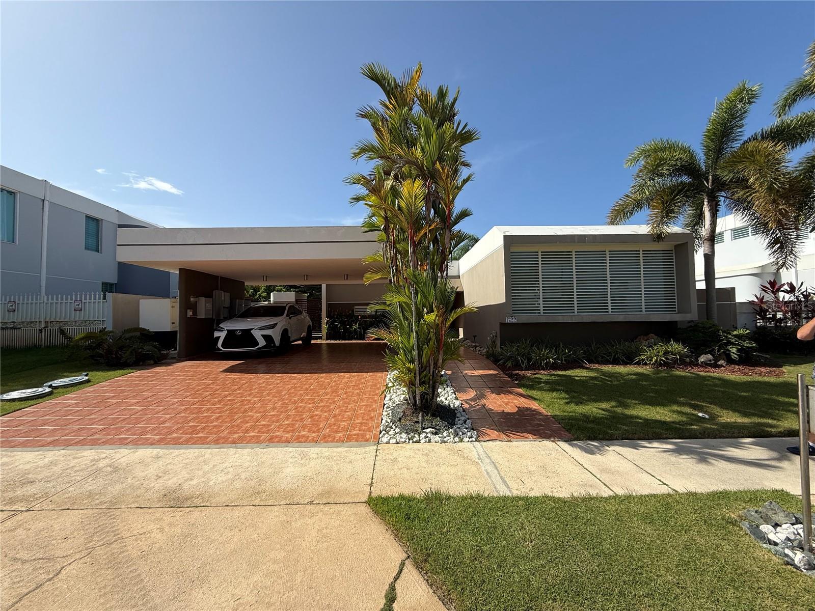 Discover this charming home in the sought-after gated community of Paseo Real in Dorado. This residence offers 3 bedrooms and 2 bathrooms, with the master bathroom beautifully remodeled and extended for added comfort. The open-concept layout seamlessly connects the family, living, and dining areas to a well-appointed kitchen, creating an inviting space for everyday living and entertaining. Step outside to enjoy a covered terrace, a private garden, and a dedicated BBQ area — perfect for hosting friends and family. The property is equipped with an Enphase 20 kW solar panel system, a solar water heater with 2 panels, a gas stove, and hurricane-proof Marva windows for efficiency and security. Community amenities include a gazebo, swimming pool, tennis and basketball courts, and a playground. Ideally located a short walk to supermarkets, restaurants, hospitals, doctors’ offices, a movie theater, and more, this home offers both comfort and convenience in a prime Dorado location.
