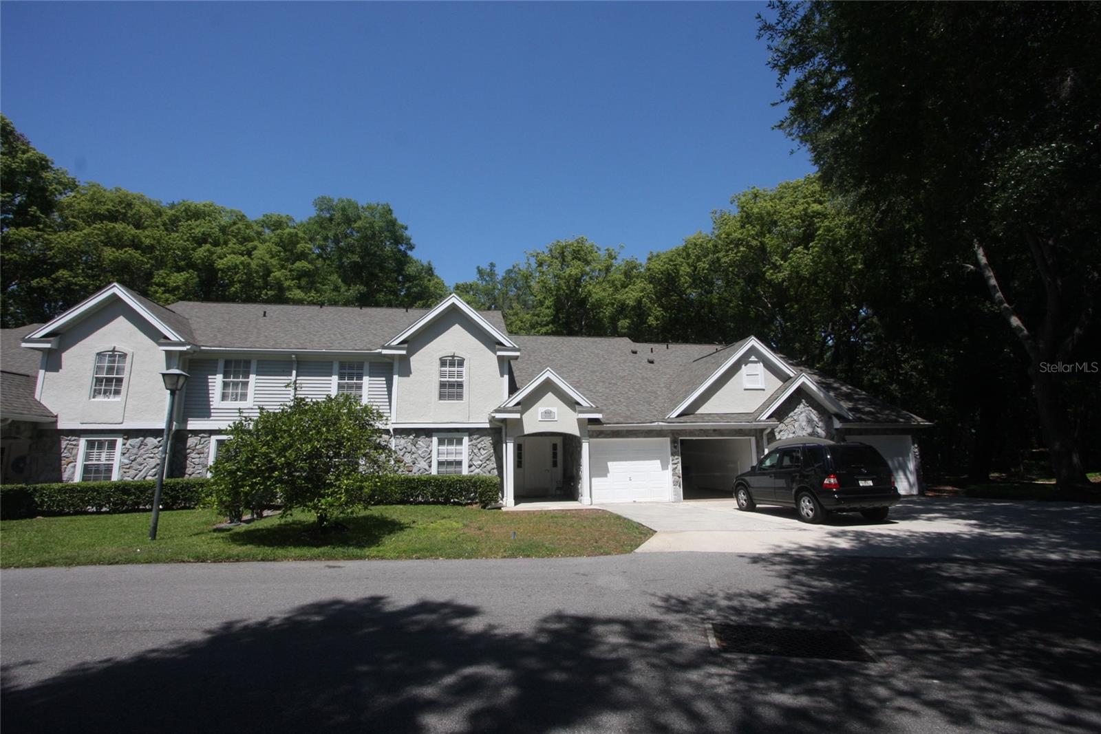 Uniquely and beautifully remodeled and updated upper level unit in move-in condition makes this unit the BEST BUY in the Apopka area! Vaulted ceilings in living and dining areas, newer luxury vinyl flooring, freshly painted interior, both bathrooms updated, screen porch at rear overlooks nature/wooded area with no rear neighbors! Dividing wall between kitchen, living room, and dining room was removed creating a large open layout! The indoor laundry room with NEW water heater, a single car garage for the owner, and ample common area parking in front of unit for guests make this a must see home in Errol Estate. Community pool and cabana building are a short walk away.