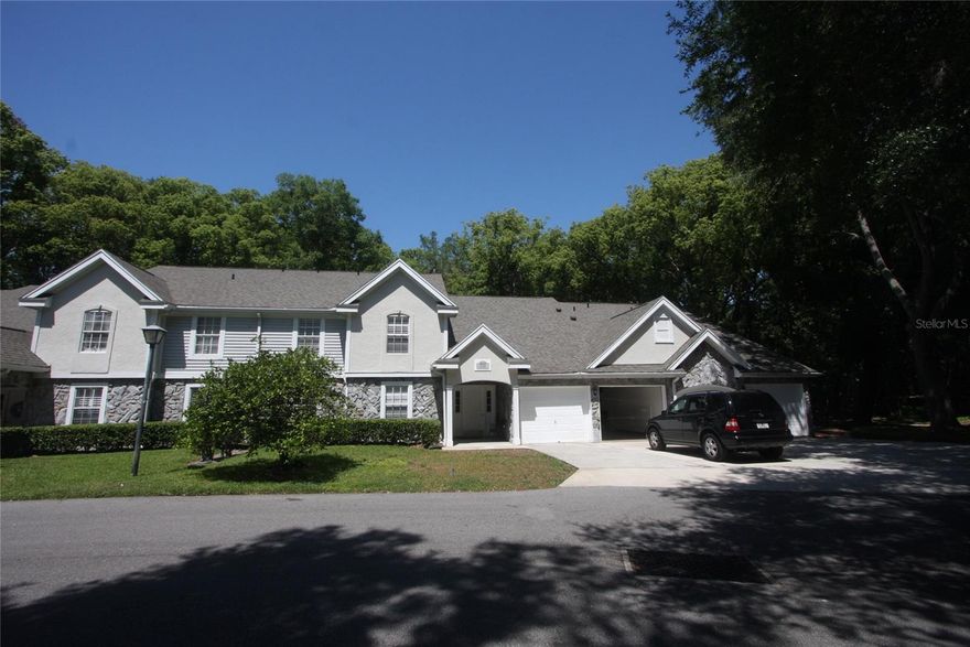 Motivated seller makes a major price adjustment on this uniquely and beautifully remodeled and updated upper level unit - that's already in move-in condition - making this the BEST CONDO UNIT BUY in the Apopka area! Vaulted ceilings in living and dining areas, newer luxury vinyl flooring, freshly painted interior, both bathrooms updated, screen porch at rear overlooks nature/wooded area with no rear neighbors! Dividing wall between kitchen, living room, and dining room was removed creating a large open layout! The indoor laundry room with NEW water heater, a single car garage for the owner, and ample common area parking in front of unit for guests make this a must see home in Errol Estate. Community pool and cabana building are a short walk away.