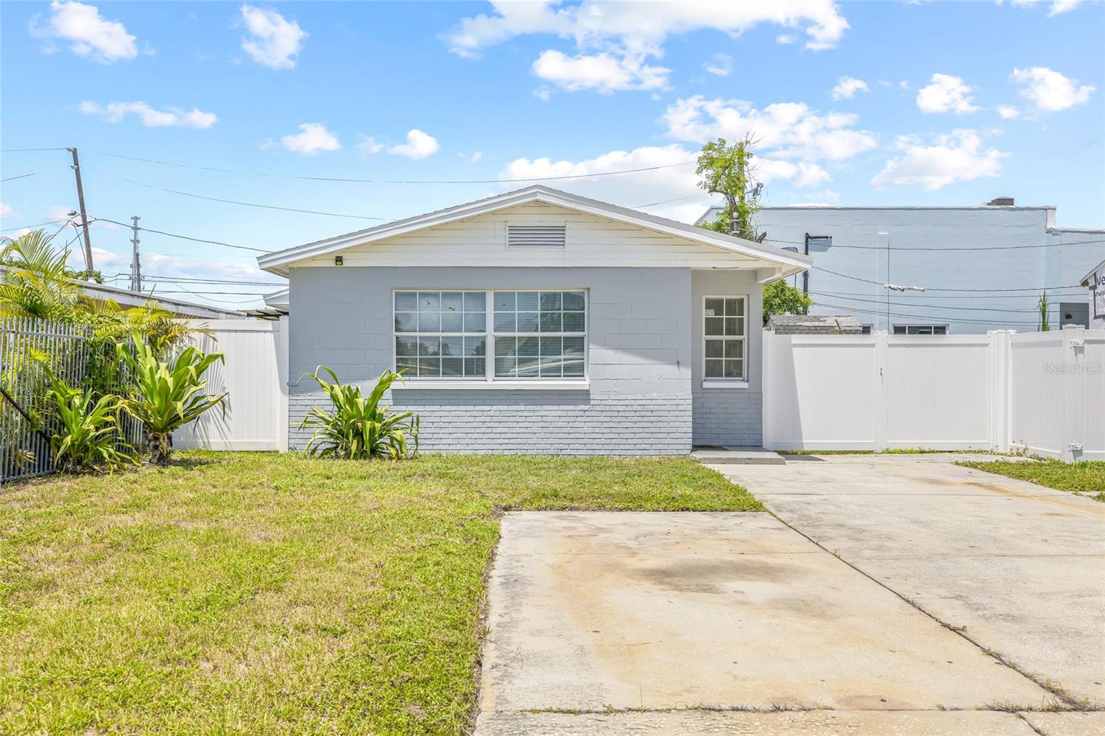 Welcome to this beautifully renovated 3-bedroom, 1-bathroom home in vibrant St. Petersburg! Located outside of a flood zone, this move-in ready gem offers comfort, style, and peace of mind. Step up to a charming exterior and walk inside to an open floor plan filled with natural light. The cozy living room is the perfect spot to unwind and enjoy your favorite movie, flowing seamlessly into the dining area and modern kitchen featuring brand new stainless steel appliances. Tucked away at the back of the home, the spacious primary bedroom boasts French doors that open to the backyard, offering the ideal blend of privacy and connection to the outdoors. Down the hall, you’ll find two guest bedrooms and a stylishly updated bathroom. Step outside to a large, fully fenced backyard with a covered back porch, perfect for entertaining or enjoying Florida’s beautiful weather year-round. Major updates include a 2023 HVAC system, new water heater, and a roof that’s only a year old—giving you a smooth and worry-free move-in experience. Conveniently located near some of St. Pete’s best restaurants, just minutes from the beach, and under 10 minutes to vibrant downtown, this home has it all.