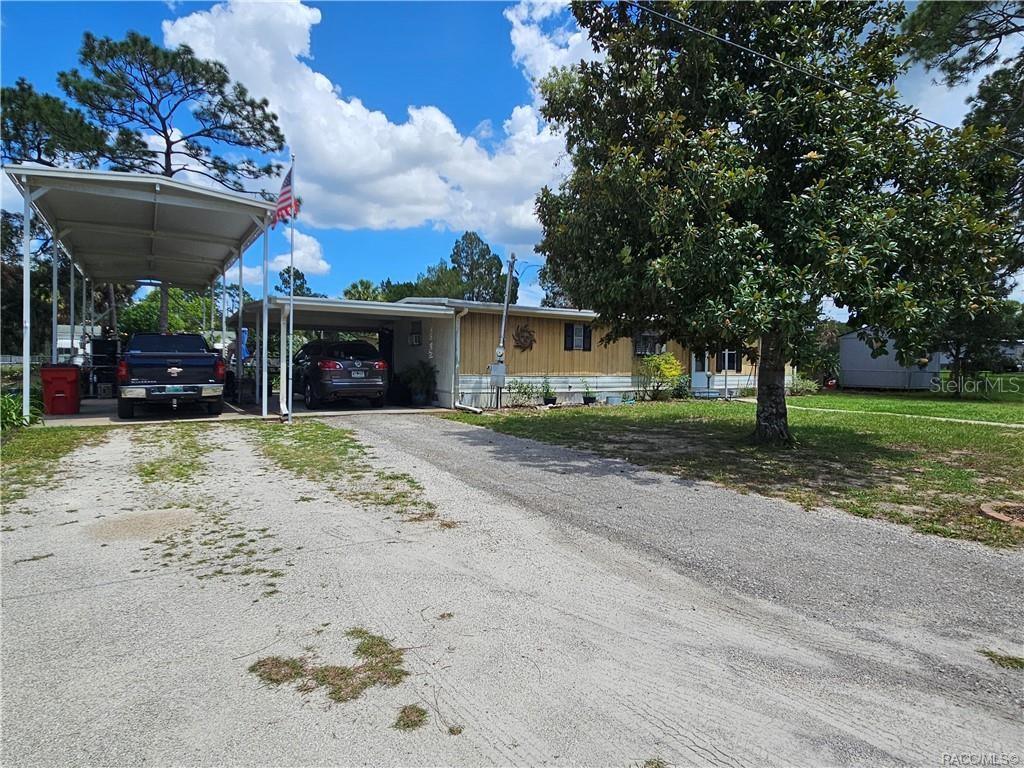 Older S/W mobile home (14 x 50 with 10 x 20 addition on back. Room has vinyl windows & tile floors & metal roof. Currently used as TV room & get away. Wall unit a/c. (Some of the vinyl windows are damaged, but no repairs to be done.) Cute M/H with open kitchen, breakfast area & living room. Small bedroom with half bath.. Great for office or small guest BR. Other end of m/h has another bedroom. Small ( 11 x 11) but holds a king size bed, dresser, chest & night stand. Fan with light. Next to bathroom. Walk in shower, sink & toilet. Nice condition . Washer in hall outside bathroom & Dryer on back room used for multi purposes. M/H has central air, but doesn't cool very good in Summer. They have wall a/c units in Living room, bedroom, back room for help in keeping home cool. Great value in RV Port (15 x 56) on concrete slab with water, electric & septic hook ups. Also carport next to home on concrete. Beautiful 15 x 20 Above ground pool. Very nice condition & very refreshing. Fenced back yard with some trees & mature plants. Private road in good condition. Gravel like material. No Deed Restrictions & no Flood zone. Prefers cash ! Not sure you can get financing on property. Very close to awesome shopping facilities.