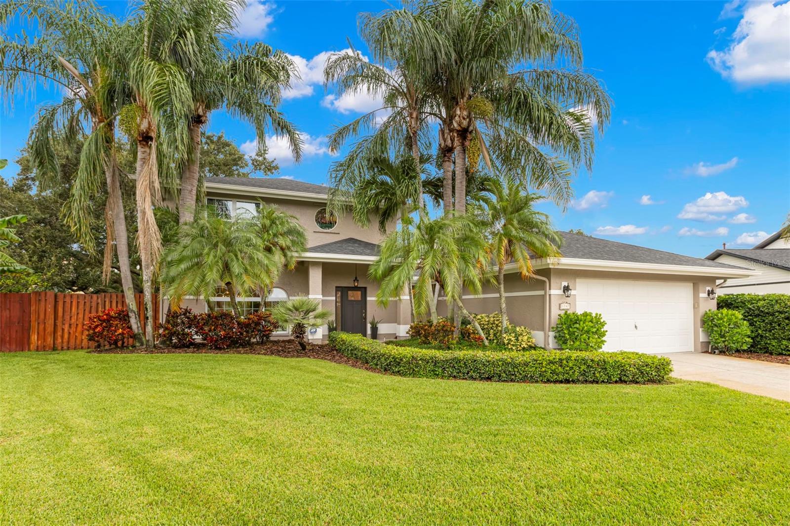 This gorgeously remodeled home has three bedrooms and three full baths. Sitting on nearly a half-acre lot directly on a lake with 116 feet of waterfront you can enjoy watching ducks, swans, and egrets from almost anywhere in the house. The home is located in one of the most private and coveted North Saint Pete neighborhoods, Glen Lake Estates. Homes rarely become available in this neighborhood and as of the listing date this is the only home for sale here.It is truly a place where you know and like your neighbors. Professionally updated by an interior designer, the home additionally features all new window treatments, light fixtures, ceiling fans, dimmer switches and upgraded architectural electrical outlets throughout. The interior is freshly painted and showcases brand new true solid oak hardwood floors (not engineered) on the second level and the stairs and gleaming travertine on the main floor. The home has new hurricane windows on both floors and a modern design throughout. The open layout highlights bright interiors and quality craftsmanship. Exterior features include updated landscaping, a spacious paver patio ideal for BBQs and entertaining, and a 2-car garage with ample parking. Offering both privacy and convenience, this property blends modern style with lasting value in one of the area’s most desirable locations. The seller is willing to sell this custom-designed home furnished with a strong offer.Truly turnkey and ready to impress. With underground utilities, newly laid fiber optic, just minutes from I-275 the home is located only a few miles from downtown Saint Petersburg, the airport, South Tampa and the beaches.