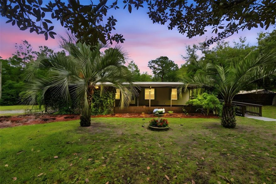 Private 2.49-acre fenced-in oasis in DeLand offering space, privacy, and so many thoughtful upgrades! This well-maintained home features a metal roof, updated plumbing, and a gated entry with sensor for added convenience and peace of mind.

Inside you’ll find an open, inviting layout with vaulted ceilings, double-pane windows, granite countertops, and stainless steel appliances. A dedicated laundry room adds extra functionality and everyday ease.

Designed with true accessibility in mind, the home includes VA-approved wheelchair access, a ramp leading into the home and directly to the primary bedroom, plus widened doorways and an accessible bathroom.
Enjoy outdoor living with sliding doors off the dining room leading to a rear deck, perfect for relaxing or entertaining. The front carport also offers great potential to be converted into a screened-in porch.

A rare opportunity to own fenced acreage with upgrades, comfort, and accessibility all in one!