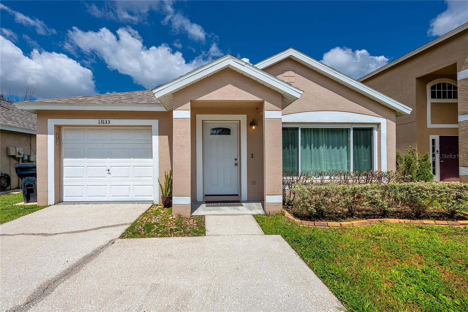 Charming Move-In Ready Home with Pond Views in Carrollwood Creek! Welcome to this beautifully maintained 3-bedroom, 2-bathroom home located in the highly sought-after Carrollwood Creek neighborhood of Tampa. Tucked away on a quiet street, this home offers the perfect blend of privacy, modern updates, and serene natural surroundings. Step inside to discover a bright, open layout with neutral tones throughout and tile flooring in the main living areas. The updated kitchen features classic white subway tile, soft-close cabinets, and ample counter space—perfect for both everyday living and entertaining. The bathrooms were tastefully renovated just 2 months ago, continuing the clean, modern aesthetic. All three bedrooms include newer carpet (installed just 2 years ago) for comfort and warmth. A newer roof (2020) adds peace of mind, new windows (2018) , newer AC (2017), along with a 1-car garage for storage and convenience. Relax or entertain on the private screened-in porch that overlooks a fenced backyard with tranquil pond and tree-lined views—a true Florida oasis. Enjoy walking distance access to Hampton Park, complete with tennis courts, a playground, swings, picnic areas, and open green space—ideal for outdoor enthusiasts and families alike. This move-in ready gem is nestled in a low-HOA community with close proximity to Carrollwood’s best amenities, shopping, dining, and commuter routes. Don’t miss your chance to call this peaceful retreat “home”!