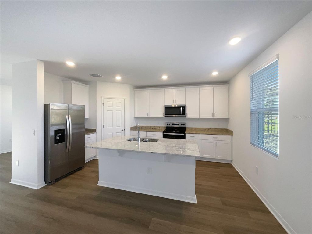 Photo of 1128 Griffon Avenue, Lake Alfred, FL 33850 (MLS # O6371024)