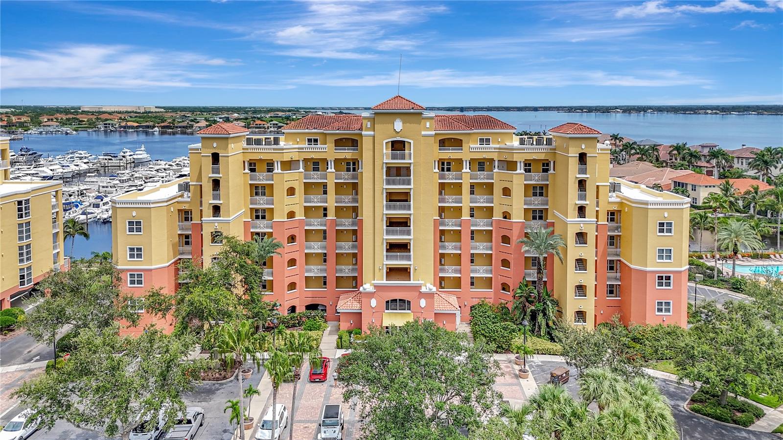 Ultra-Modern and refined describes this unrivaled two story, two balconied, condominium found at the exclusive boating community of Laguna at Riviera Dunes. This residence comes with its own interior residence elevator if you choose not to take the uniquely designed staircase connecting two floors of 4,244 square feet of living “the Florida Lifestyle”.This residence was designed by an interior designer and by using the owner’s exquisite taste, updating every aspect of its structure to include 3 oversized ensuite bedrooms and 4 ½ bathrooms. the primary suite offers separate his and hers bathrooms. A large inviting living room, billiard room, private office with built-ins, and a family room offers that special buyer a space to work, relax, and play. Cooking is done in a dream chef’s kitchen, totally re-designed complete with all new appliances, all new flooring, with every convenience and detail painstakingly thought out. A whiskey bar and coffee stations (one on each floor) for those sunrise and sunset moods. A large laundry room is equipped with a tiled dog bath/shower stall for fido. Lighting was especially taken into the design element of this residence, offering ambiance and mood pleasing times spent here. There are loads of built-ins and design touches everywhere. This condominium residence also comes with an abundantly oversized, enclosed two car garage with ample room for storage located in the under-building parking area. The views abound from two floors of glass lined floor to ceiling walled sliders leading out to the marina facing balconies. Views off the main floor living area and off the primary bedroom.give you a view not only of the marina, but of lakes and the Manatee River. For the boater, who is looking for a storm-resistant marina, there are boat slips available for sale or rent. The condominium is part of Laguna at Riviera Dunes which offers amenities including a swimming pool, tennis courts, gym, clubhouse, dog walking area and miles of walking paths. There is an onsite public restaurant, and you are close to all of the sun coast’s world-famous beaches. You are also a short drive to downtown Bradenton, Anna Maria Island and Sarasota with its fabulous restaurants, entertainment, and resort vibe. This condominium is perfect for that discriminating buyer who is looking for the ultimate full-time residence or vacation home. Schedule your private showing of this piece of paradise today.