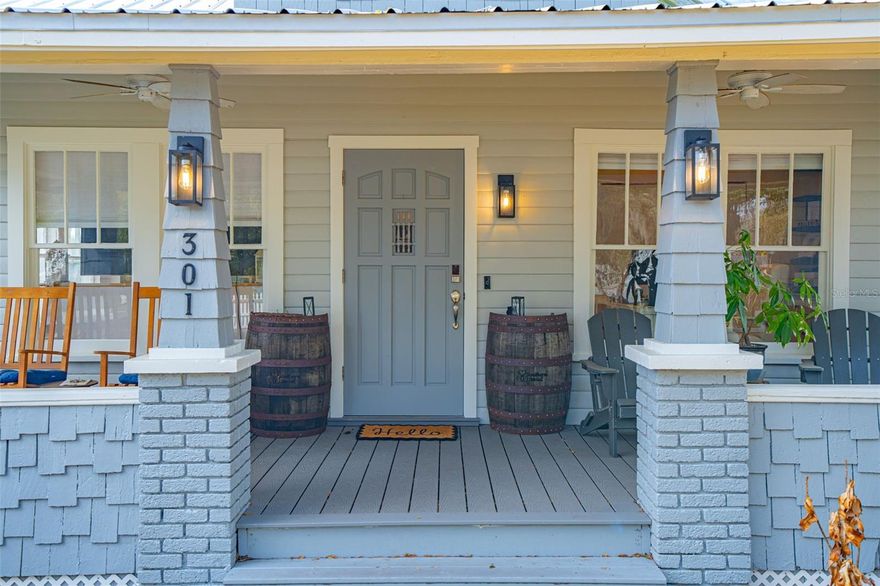 Welcome to a rare opportunity to own a fully renovated historic 1919 charmer in the heart of Orange City. This turn-key beauty blends timeless character with thoughtful, high-end updates: truly no stone has been left unturned. Perfectly positioned on a .38-acre corner lot and wrapped in a classic white wooden picket fence, this home offers storybook curb appeal paired with modern functionality. Inside, you’ll find an inviting open-concept layout where the living, dining, and kitchen spaces flow seamlessly together, ideal for both everyday living and entertaining. The kitchen has been tastefully designed with a gas range, center island, and dedicated eat-in space, creating the perfect gathering spot. The primary bedroom is conveniently located on the main floor and features a beautifully updated ensuite bathroom, with the washer and dryer just down the hall for added ease. A downstairs office with a window and closet offers flexibility as a fourth bedroom, guest room, or work-from-home space. Upstairs, a spacious loft leads to two additional bedrooms and a stunning bathroom complete with a clawfoot tub, separate shower stall, and elegant vanity: a true nod to the home’s historic roots with modern luxury woven in. The main-floor bathroom showcases a beautifully designed walk-in shower and stylish vanity. Outdoor living is just as impressive. Enjoy mornings on the front porch and evenings on the rear porch overlooking the expansive yard. The covered carport offers convenient parking, while the extended gravel area provides additional space for guests, entertaining, or recreational vehicles. The gravel continues to a charming fire pit area: perfect for gathering under the stars, a shed conveniently located just beyond, tucked near the carport for easy access. A durable metal roof adds long-term value and peace of mind. Location is everything, and this home delivers. Walking distance to Orange City City Hall, where local holiday festivities and community events are held, and just minutes to everyday conveniences, shopping, and dining. Quick access to I-4 makes commuting effortless, and you’ll love being centrally located between New Smyrna Beach and Orlando... giving you the best of both coastal relaxation and city excitement. Historic charm. Modern upgrades. Prime location. This home is truly gorgeous and ready for its next chapter. Schedule your private showing today and experience the character, craftsmanship, and convenience of this one-of-a-kind Orange City gem before someone else calls it home.