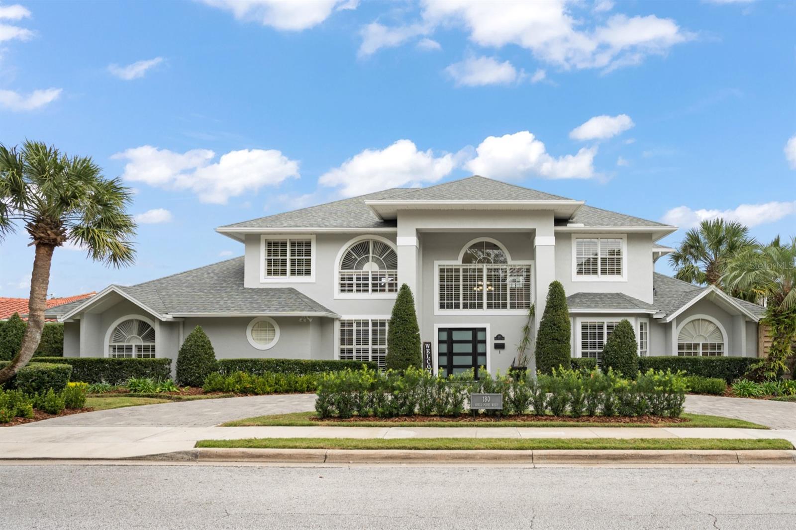 One or more photo(s) has been virtually staged. Nestled on a meticulously landscaped canal-front property with direct access to Lake Maitland and the Winter Park Chain of lakes, this renovated five-bedroom, four-bath home by Parkland Homes offers a perfect blend of sophistication and comfort. Boasting a thoughtful design with many recent updates, this residence presents a warm and inviting ambiance, complete with private boat house. The open and expansive living spaces create an ideal setting for seamless entertaining, with a chef-inspired open kitchen serving as the heart of the home. Revel in culinary delights with updated cabinets, stainless steel appliances, gas range, warming drawer, granite countertops, and reverse osmosis. The adjacent dining area sets the stage for both formal and informal gatherings, while a new gas fireplace with added mantel in the family room provides a tranquil retreat. The newly painted stairway and railings lead to a spacious and versatile game room complete with bar that opens up a world of possibilities. Step outside onto the new open deck for stunning views of the backyard, pool area, and waterfront. Two bedroom suites grace the first floor, including a main primary suite with generous walk-in closet and luxurious master bath featuring a large soaking tub, separate shower, and dual vanities with granite countertops. Another first-floor suite caters to in-law accommodations or visiting guests. The second floor hosts three bedrooms and two full baths, one of which is en-suite. Your outdoor entertaining begins as you step out onto a breathtaking 600-square foot lanai through pocket sliding doors. This private oasis features retractable screens, a saltwater pool, heated spa (2018), and ample space for hosting family and friends. The meticulously landscaped backyard provides a serene setting, complemented by mature landscaping, lower firepit area, and lush artificial turf. This home boasts a plethora of updated features including: fresh exterior paint, new front door, landscaping, landscape lighting, wood plantation shutters, custom built-ins, closet storage systems, and two new Trane 4-ton 19.5 seer units (2020) air conditioners, and new roof (2021). The 2016/17 remodel saw the entire house replumbed, upgraded flooring, replacement of door hardware, and additional canned lights. All baths underwent a complete overhaul with new showers, tubs, sinks, fixtures, and granite countertops. Electrical outlets and switches were upgraded, and three custom built-ins were incorporated. Outdoor enhancements include a new cement driveway, revamped pool area with new heater, plaster, coping, and pavers, conversion to a saltwater pool with a continuous monitoring system, and the addition of a child safety fence in 2019. The side yard was fenced, and a carport was added to the driveway. The newly improved boat house boasts new siding, painted and sealed roof, lift hardware, new straps, and the lift motor was replaced in 2020. With access to Lake Maitland and the Winter Park Chain of Lakes, this residence offers an exceptional waterfront lifestyle in a very sought after neighborhood. Zoned for A-rated Maitland Middle School and Winter Park High School, this home exemplifies the epitome of luxury living.