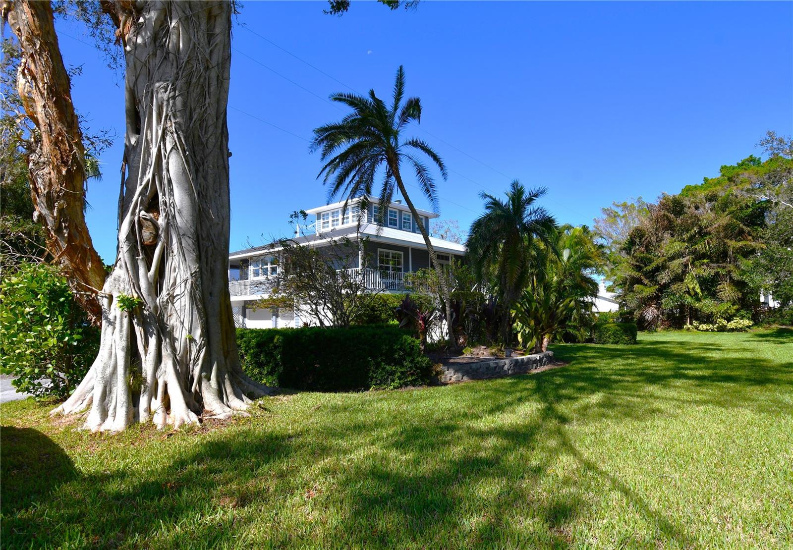 Escape to Your Perfect Tropical Retreat!
Prepare to be captivated by this stunning waterfront home, designed to make your getaway unforgettable. Step inside and bask in an open, light-filled floor plan enhanced by double French doors and over 30 windows that invite in natural light and frame breathtaking water views. The modern, fully-equipped kitchen boasts granite countertops, stainless-steel appliances, a cozy breakfast nook, and an expansive eight-seater dining table—ideal for memorable family dinners with sunset views over the water. The oversized master suite is your personal oasis, featuring a luxurious king-sized bed, a spacious walk-in closet, and private access to the wrap-around screened porch overlooking the water. The spa-like master bathroom includes a soaking tub and walk-in shower, offering the ultimate relaxation experience. Two additional bedrooms are designed to suit all your needs. One offers a queen bed, while the other doubles as an office, complete with a queen Murphy bed for extra sleeping space. Venture upstairs to discover a spacious loft, set up as a movie room with a private balcony overlooking the bay—perfect for unwinding with more stunning views. Outside, a scenic boat dock awaits, complete with water and electricity access, ideal for kayaking or docking a small boat. And when you’re ready to explore, you’ll find Sarasota Airport just 5 minutes away, downtown Bradenton and Sarasota within 10 minutes, and pristine beaches only 20 minutes from your door. Book now and start your dream vacation in paradise!