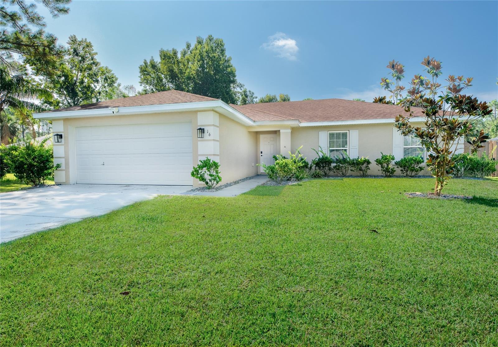 LOOKING AT NEW CONSTRUCTION - Check Out this Like-New Seagate Bermuda Model – Updated & Priced to Sell at $285,500!
Welcome to 16 Radium Lane, a beautifully maintained Seagate Bermuda Model built in 2019 and enhanced with thoughtful updates. While the first owner never occupied the home, the second owner has added valuable upgrades that make this property truly move-in ready. This 3-bedroom, 2-bath, 2-car garage home sits on an 80x125 lot in a desirable Palm Coast neighborhood. Inside, you’ll find new luxury vinyl plank flooring throughout the main living areas and all 3 bedrooms, plus a stylish kitchen backsplash that perfectly complements the refinished light gray wood cabinetry and granite countertops. The open layout makes this home feel bright, spacious, and welcoming. Outside, enjoy a covered rear porch overlooking the newly landscaped and fully fenced backyard, ideal for entertaining, pets, or simply relaxing in privacy. A sprinkler system with well adds convenience for maintaining the lush lawn. Why wait to build when you can have a nearly new home with upgrades already in place—all at just $285,500, well below today’s market! In the heart of Palm Coast Florida central to schools, shopping and hospitals. Schedule your showing today before it’s gone.