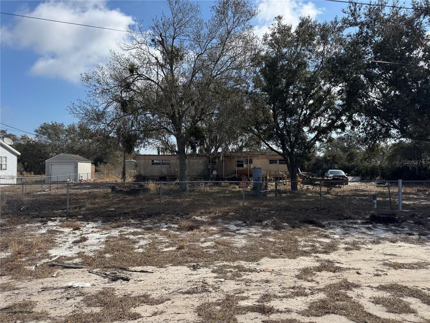 Nearly 1 acre (.95 acres) in Lake Wales with well, septic, and electric already in place. High and dry lot with no HOA restrictions. Property currently includes an older manufactured home in need of substantial repair. Value is in the land and existing improvements. Buyer may choose to renovate the current structure or remove and replace with a new manufactured home or site-built home. Buyer to verify all zoning and building requirements. Plenty of space for outdoor living, equipment storage, or future improvements. Convenient opportunity for investors, builders, or buyers looking for a project. Bring your ideas and make this property your own.