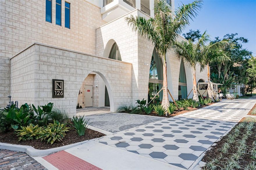 Luxurious BOUTIQUE CONDO in highly sought after THE NOLEN now available. The Nolen is an equisite NEW BUILDING with ONLY 31 PRIVATE RESIDENCES, and 23 stories located at St. Petersburg's most exclusive address. This stunning retreat features a PRIVATE ELEVATOR that opens up to your residence with NO NEIGHBORS, and no shared walls. The 3 bedroom 3 bath home has 2156 square feet, double door entry, and soaring 10 FOOT CEILINGS thoughout – including the 38 foot terrace outside.
The designer kitchen is a chefs dream with cabinet covered Thermadour appliances, Cambria quartz island, backsplash and countertops, a granite farmhouse sink, and separate wine and bar area. The whole condo offers Expansive Views of the Water and Downtown though the large Floor to Ceiling, Impact Rated Windows. This condo FACES SOUTH so it also gets amazing light all day.
This sleek home features a SPLIT PLAN, with a Guest Ensuite and Private Bath, a Second Bedroom, and Guest Bath on East wing. The Master Suite encompases the West wing with an inlay ceiling, a door to your long balcony, and a huge master closet ready for you to design. The spa inspired bath features a free standing tub , and oversized glass-enclosed shower with dual rainfall and wall-mounted shower head, a floating dual-sink vanity, and sleek wall-mounted chrome fixtures. The condo also has a private laundry room with a separate utility room behind it. 
The fourth-floor amenity level elevates everyday living with a Saltwater Pool and Spa, Covered Cabanas, fire pits, BBQ station, a Posh Club Lounge, a fully equipped fitness center, and a private room for your massage therapist. Modern upgrades include a WHOLE BUILDING GENERATOR, energy-efficient infrastructure, an integrated WATER SOFTENING SYSTEM and The Nolen is an NGBS -CERTIFIED GREEN BUILDING.  
The condo has and exclusive 12 x 7 AIR-CONDITIONED STORAGE UNIT right in front of your parking space. Unit 602 comes with the Best Parking Space, as it is the closest parking spot to the elevator! The unit also comes with a bonus second covered parking space (also right next to the elevator). Both spaces are pre-wired for EV charging. 
The incredible architecture at The Nolen pays homage to John Nolen, once named as “Godfather of American City Planning”, and the first city planner to create Downtown’s waterfronts, green spaces, and city sprawl design.  The award winning coffee shop and new salon downstairs opening soon!
At The Nolen, downtown is downstairs! Experience the finest shopping, dining, culture, exercise spaces, and entertainment just steps away. This is  BRAND NEW CONDO that has NEVER BEEN LIVED IN.