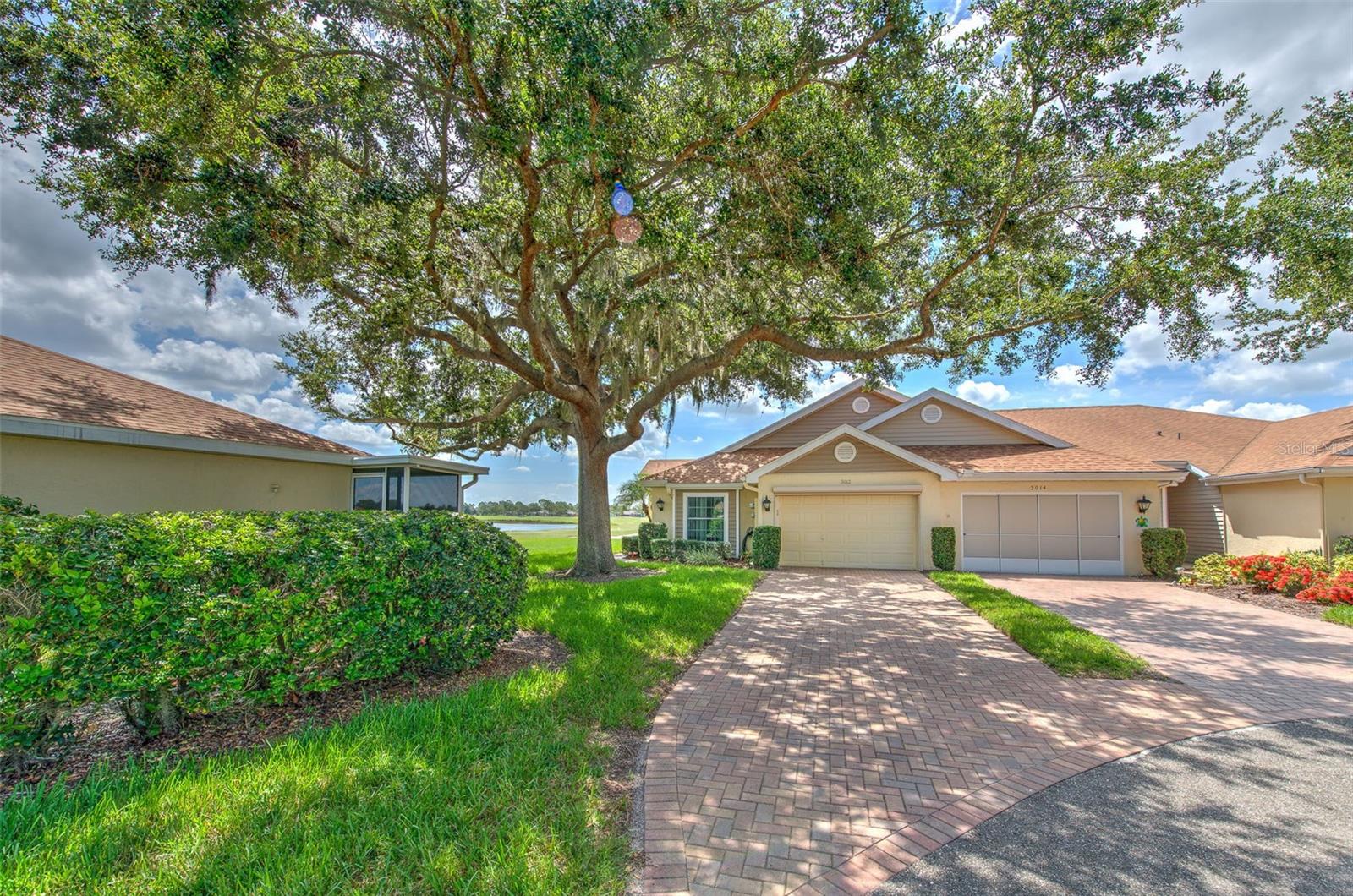 Pride of ownership shows in this beautifully updated 2/2 villa situated on a tree-lined cul-de-sac with serene water and golf course views. Brick paver driveway and walk usher you into this large open villa designed with a smart split-bedroom floor plan, offering privacy and comfort for all. The spacious main living area features large windows throughout, seamlessly bringing the outdoors in and filling the space with natural light. The kitchen is a chef’s dream, showcasing upgraded cabinetry with crown molding, soft-close doors and drawers, deep pot drawers, a stylish tile backsplash, quartz countertops, and a charming cast iron apron sink. Cooking is a pleasure with recessed lighting and a brand-new GE oven/range. Main living areas boast brand new luxury vinyl plank flooring and both bedrooms feature easy care ceramic tile flooring. Enjoy relaxing mornings in the sunroom or unwind in the evening with a glass of wine watching the most spectacular sunsets and the best of mother nature. This villa has been thoughtfully updated with numerous upgrades, including hurricane rated Impact Windows (2020), freshly painted interior, new luxury vinyl flooring throughout main living area & brand new GE Oven. With stunning views and stylish upgrades throughout, this home is truly move-in ready. Don't miss the opportunity to live in comfort and style in this exceptional villa! Kings Point is one of America's premier 55+ active adult communities—where lifestyle, leisure, and location come together seamlessly. Enjoy over 200 clubs and activities, plus a wide range of resort-style amenities: multiple swimming pools, state-of-the-art fitness centers, on-site restaurants, and more. Whether it’s tennis, pickleball, lawn bowling, shuffleboard, or simply socializing, there’s something for everyone. Catch live entertainment and touring shows right in the community or explore the surrounding area. Ideally located near shopping, dining, medical facilities, major highways, Tampa, Sarasota, beautiful Gulf beaches, and Orlando’s famous theme parks—you're at the heart of it all. Whether you prefer staying active or relaxing while enjoying serene golf course or nature views, Kings Point offers the lifestyle you’ve been dreaming of. Don’t wait—start your Florida dream today!
Property is being sold as-is for the seller’s convenience.