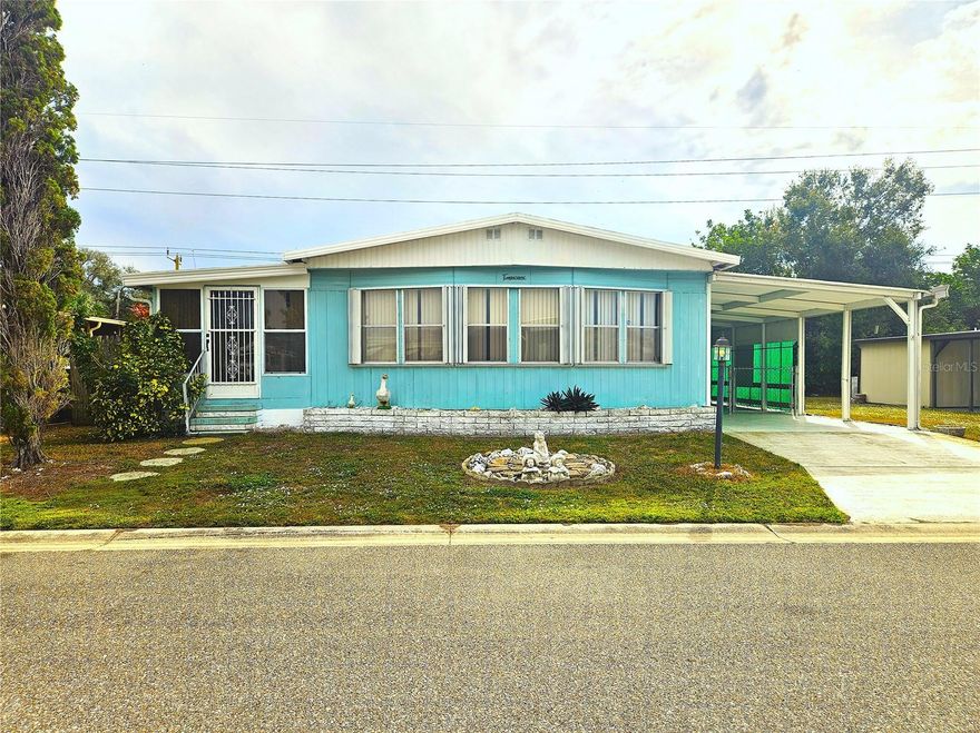 Welcome home to this beautifully, land-owned mobile home in the desirable Casa Loma community! Enjoy a low HOA and no age restrictions in this friendly neighborhood. This charming 2-bedroom, 2-bath home features ample space with endless possibilities. The primary bedroom offers an en-suite bath with a walk-in shower and a spacious walk-in closet, while the living room showcases panoramic windows that fill the space with natural light. The dining room includes a built-in buffet with overhead cabinetry for added storage, and the cozy Florida room provides a second entrance to the home. A large exterior utility room houses the washer and dryer with plenty of additional storage. Please Note: sections of the subflooring will need replacement, and the price already reflects this condition; a quote for full subfloor and flooring replacement is available upon request. The Casa Loma community offers great amenities, including a pool, shuffleboard court, and a clubhouse with various activities. This is the one!