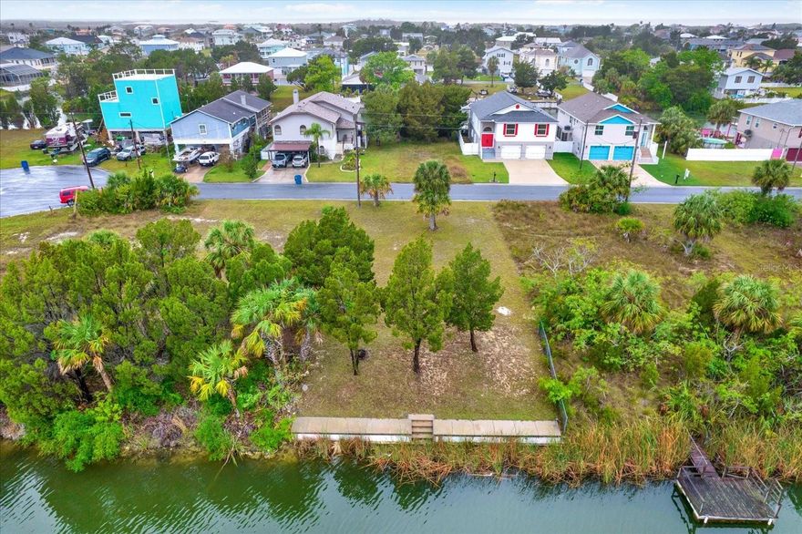 This amazing waterfront 5,000 SF (50 X 100) residential lot all but awaits the construction of your Florida dream home.  Naturally level landscaping.  Desirably located near the end of the cul-de-sac featuring indirect access to the Gulf of America, this property checks all the boxes. Water, sewer and power connections are located at the street.  No HOA fees and Short-Term rentals are allowed.  Hernando Beach offers the best of Florida living and is a boating paradise with fishing, scalloping, kayaking and more. Book your private showing today!

** Adjoining lot also for sale as a consideration for a larger home or yard/entertaining space.