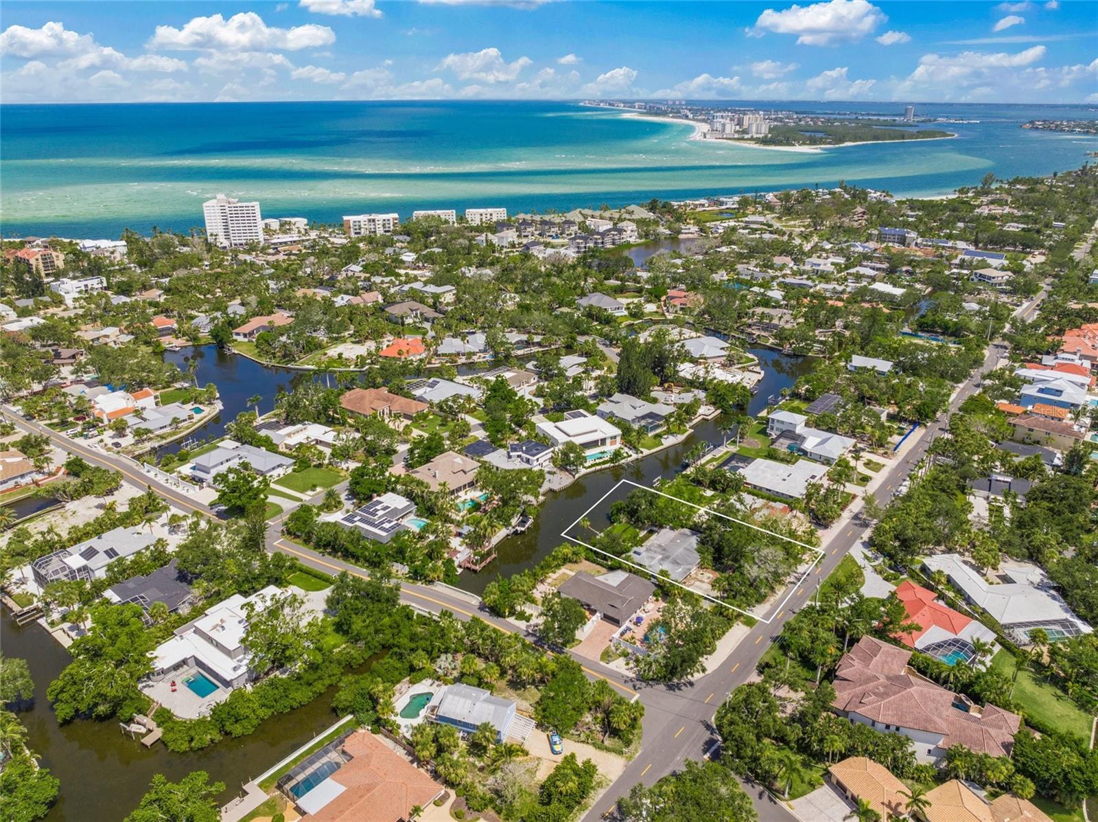 Opportunity Awaits on this .37 of an acre (approximate dimensions 100' x 158') on Siesta Key with Western Exposure. The existing structure is ready to be removed and a new home would be best suited for this great lot. Current structure features 3BR/3BA with a pool ~ but the home did suffer severe water damage and is now being "sold as is" for lot value only. This nice, oversized lot has a great location ~ just a short bike ride to Siesta Village.
