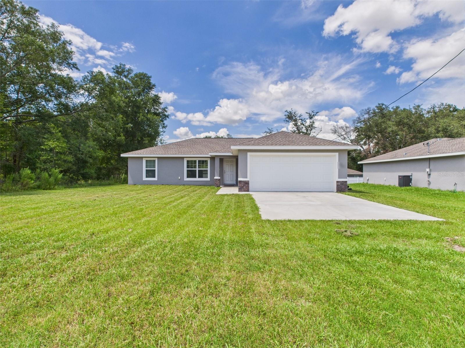 One or more photo(s) has been virtually staged. For rent at $1,800/month, this charming 3-bedroom, 2-bathroom home in Dunnellon offers peaceful country living with no HOA restrictions. Nestled in a tranquil, nature-bound setting, this property is perfect for those seeking a quiet retreat surrounded by natural beauty. The spacious master bedroom features a walk-in closet and private en-suite bathroom, creating your own serene haven. An open layout connects the living, dining, and kitchen areas—ideal for everyday comfort and entertaining. The generous yard provides plenty of outdoor space for relaxation, gardening, or enjoying the sounds of nature. Experience the calm of country life with the freedom to truly make this home your own — schedule your private showing today!
