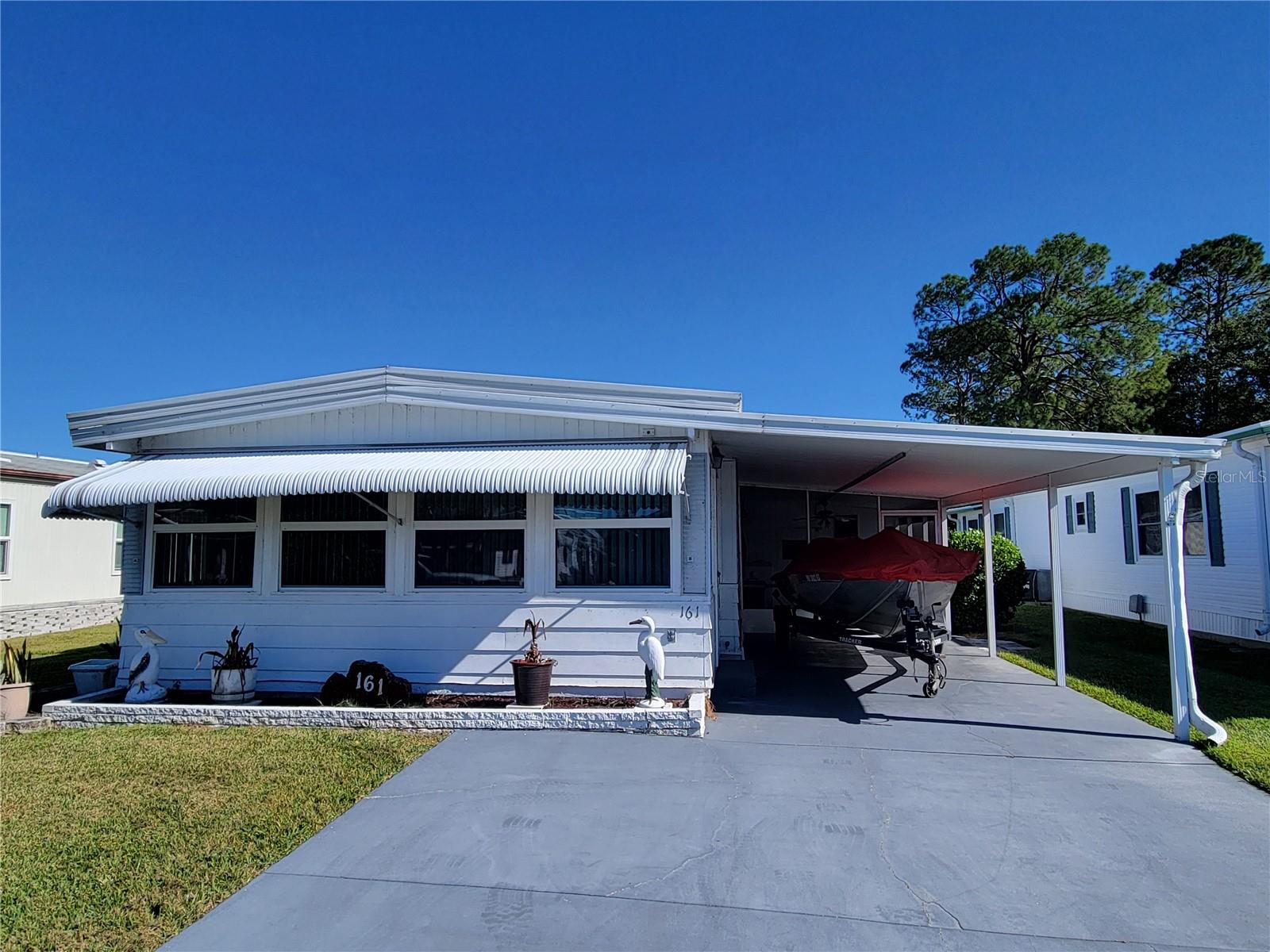 2Bd/2Ba Waterfront Home in 55+ Auburndale community, Own your land, Low HOA fees of $39 monthly, listed at $130,000. Located on terrific fishing lake - Lake Marianna. Keep your boat in your boathouse & head out to fish. New Hot Water Heater in April 2025. New Anchors & Tie-Downs were installed in May 2025. Great location with minimal traffic, fully furnished with upgrades. Bonus room has been fully enclosed. Marianna Park is a small Mobile Home Community in Auburndale with 100 homes. Clubhouse, shuffleboard & boat ramp all within the community. All information deemed to be accurate and true. Please have Buyer(s) verify any/all information critical to home purchase in this community