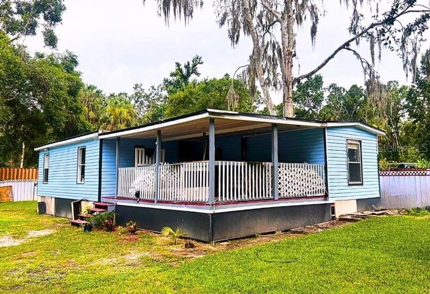 UPDATED LANDSCAPING..Spacious and updated double-wide in the heart of South Brandon! This 4-bedroom, 2-bath home offers generous living space plus a den—perfect for a home office, creative space, or extra storage. Much of the home has been beautifully remodeled, including reinforced subflooring, ceramic tile, and wood flooring in the secondary bedrooms.

One bedroom opens to an unfinished private deck—ideal for future outdoor enjoyment. The home features newer ductwork throughout, a central HVAC package unit just a couple years old, and a roof that’s under 2 years old with a transferable 15-year warranty for peace of mind.

Set on over one-third of an acre at the end of a quiet dead-end street, this fully fenced property offers privacy and versatility. There’s ample room for RVs, boats, or work vehicles—and even enough space to add another mobile home or build a second dwelling. A beautifully cultivated garden is already producing spices, vegetables, and more, with additional planting underway—perfect for homesteaders or gardening enthusiasts.

Additional upgrades include a spacious 20x14 covered front porch, and the home is just half a mile from the Brandon boat ramp—ideal for outdoor lovers. Best of all, the property currently generates approximately $3,000 a month on Airbnb, offering an excellent income opportunity for investors or buyers looking to supplement their mortgage.

With continued improvements, a flexible layout, and tons of potential, this unique property is priced to sell—schedule your showing today!
