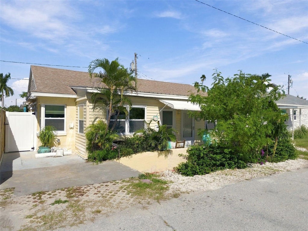 Photo of 78 146th Avenue E, Madeira Beach, FL 33708 (MLS # TB8559356)