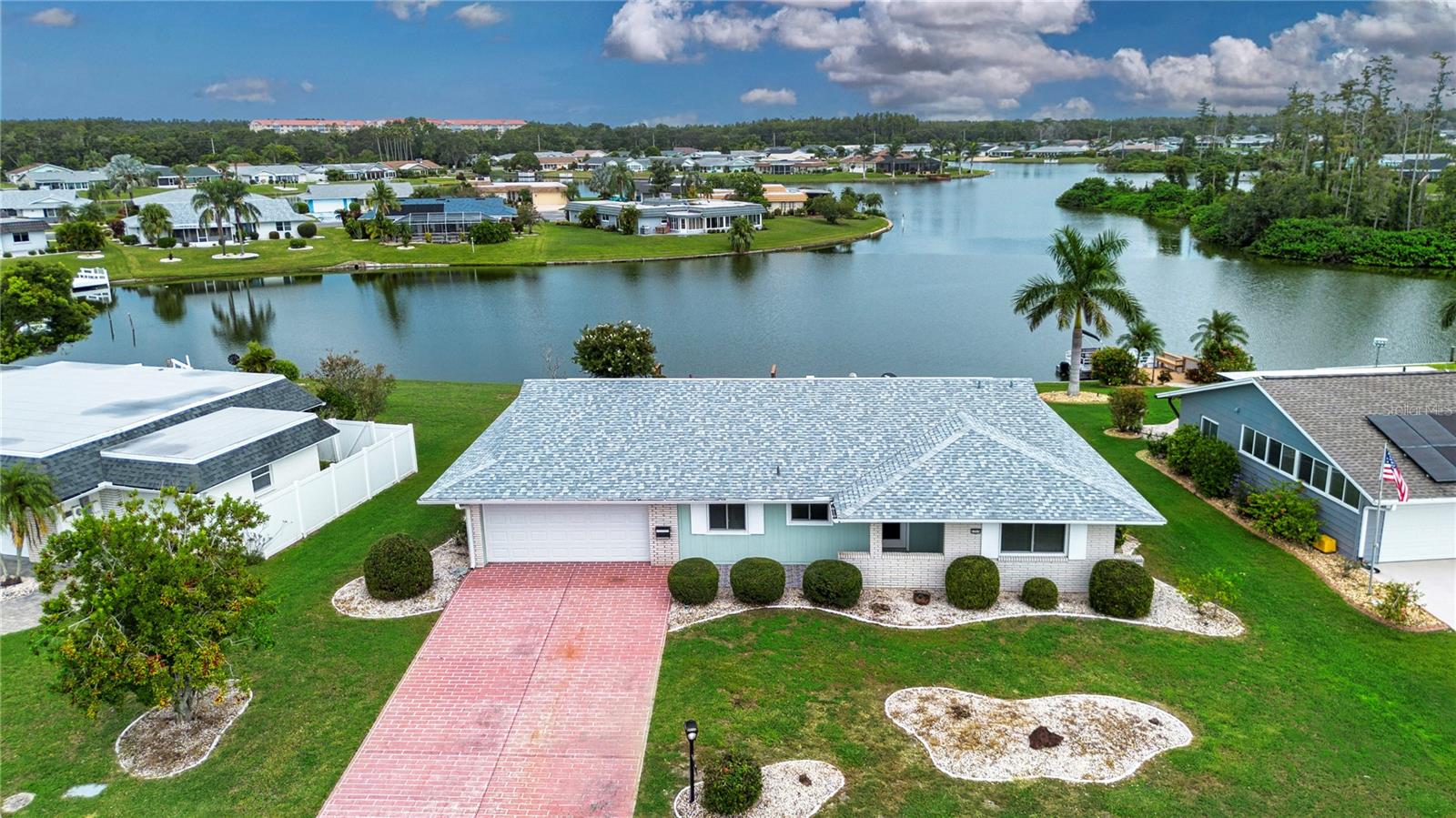 One or more photo(s) has been virtually staged. Welcome to Sun City Center’s Middle Lake. A private 40-acre lake with an updated dock and seawall ready for your pontoon boat or kayaks. Lots of fishing and birdwatching opportunities await. This wonderful 3-bedroom 2-bath home has BRAND NEW LAMINATE FLOORING in the main living areas, FRESHLY PAINTED and is MOVE-IN READY. The family room overlooks the lake and features updated sliding doors out to an open patio with brick pavers. The screened lanai features a hot tub and outstanding views of one of two islands on the lake. Budget friendly IRRIGATION WATER PUMPED DIRECTLY FROM THE LAKE providing you with a nice green lawn all year long. 6 windows and exterior doors have been updated. *ROOF 2020 * A/C 4- ton unit 2019 * WATER HEATER 2019 *Square D electric panel box * NEW GARAGE DOOR 2025 * Golf Cart included. Located just minutes away from the central recreation campus of America’s #1 rated retirement community with a large variety of clubs and activities to enjoy. Golf cart friendly all over town with accessibility to stores, restaurants, medical facilities, financial services, houses of worship and volunteer opportunities.
Minutes away is I 75 with a short drive to Tampa, Sarasota and St. Petersburg, near 3 airports, beaches, theater, museums, fine dining, advanced medical, special events and major league sports too. What a great place to be living the dream!