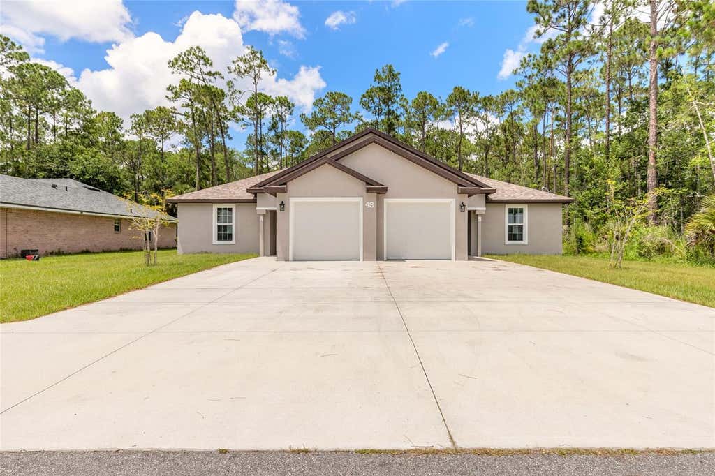 Photo of 48 Regency Drive, Palm Coast, FL 32164 (MLS # V4950271)