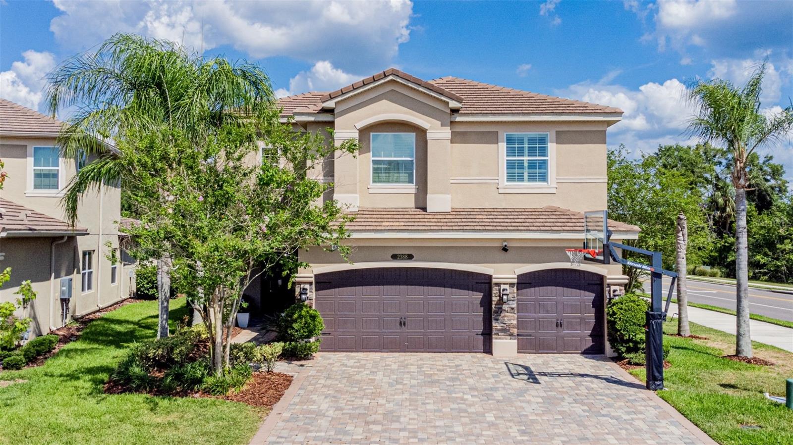 Seller offering $10,000 buyer concessions. Exclusively redefined. Gated Luxury Living. Now is your opportunity to live and experience the luxury of living in the prestigious gated community of The Ridge at Wiregrass , located in the heart of Wesley Chapel! This stunning property, listed at an incredible price, offers the perfect blend of modern luxury and timeless elegance. Step inside and be greeted by a grand foyer with soaring ceilings and natural light pouring in from the large windows. The open and spacious layout of this home is perfect for both relaxing and entertaining. The visually pleasing design features sleek luxury vinyl flooring, crown molding, and custom lighting throughout, creating a warm and inviting atmosphere. The kitchen is a chef's dream, complete with quartz countertops, stunning backsplash, top-of-the-line stainless steel appliances, a large kitchen island, a breakfast bar, cozy dining nook, and ample storage space. The home also features a Great Room with a cozy fireplace and a separate formal dining room with custom tiled ceilings for hosting elegant dinner parties. Upstairs, the master bedroom is a true retreat, boasting a spa-like en-suite bathroom and a walk-in closet with built-in shelving. 5 additional bedrooms can also be found, with one doubling as an at-home office with its built-in desk and shelving. The upstairs also offers a loft which makes for plenty of space for the whole family to spread out and make themselves at home. Step outside to the backyard oasis and take in the peaceful surroundings on the porch that features custom pavers, sun shades, and stunning conservation views. With a fully fenced-in yard and no rear neighbors, you will feel like you are in your own private sanctuary. The Ridge at Wiregrass features amenities, such as a clubhouse, a 24-hour community fitness center with indoor sports, rec courts, a movie theater, ping pong and pool tables, resort-style pools, cabanas, kids splash pad, a kids park. The community also features a staffed guardhouse to ensure your safety, a private side gate exclusively for residents right across from the top-rated Wiregrass schools, and a crossing guard present daily during school hours. Call today for your private tour!