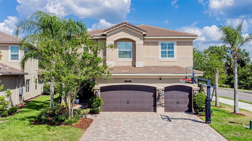 Seller offering $10,000 buyer concessions. Exclusively redefined. Gated Luxury Living. Now is your opportunity to live and experience the luxury of living in the prestigious gated community of The Ridge at Wiregrass , located in the heart of Wesley Chapel! This stunning property, listed at an incredible price, offers the perfect blend of modern luxury and timeless elegance. Step inside and be greeted by a grand foyer with soaring ceilings and natural light pouring in from the large windows. The open and spacious layout of this home is perfect for both relaxing and entertaining. The visually pleasing design features sleek luxury vinyl flooring, crown molding, and custom lighting throughout, creating a warm and inviting atmosphere. The kitchen is a chef's dream, complete with quartz countertops, stunning backsplash, top-of-the-line stainless steel appliances, a large kitchen island, a breakfast bar, cozy dining nook, and ample storage space. The home also features a Great Room with a cozy fireplace and a separate formal dining room with custom tiled ceilings for hosting elegant dinner parties.  Upstairs, the master bedroom is a true retreat, boasting a spa-like en-suite bathroom and a walk-in closet with built-in shelving. 5 additional bedrooms can also be found, with one doubling as an at-home office with its built-in desk and shelving. The upstairs also offers a loft which makes for plenty of space for the whole family to spread out and make themselves at home. Step outside to the backyard oasis and take in the peaceful surroundings on the porch that features custom pavers, sun shades, and stunning conservation views. With a fully fenced-in yard and no rear neighbors, you will feel like you are in your own private sanctuary. The Ridge at Wiregrass features amenities, such as a clubhouse, a 24-hour community fitness center with indoor sports, rec courts, a movie theater, ping pong and pool tables, resort-style pools, cabanas, kids splash pad, a kids park. The community also features a staffed guardhouse to ensure your safety, a private side gate exclusively for residents right across from the top-rated Wiregrass schools, and a crossing guard present daily during school hours. Call today for your private tour!