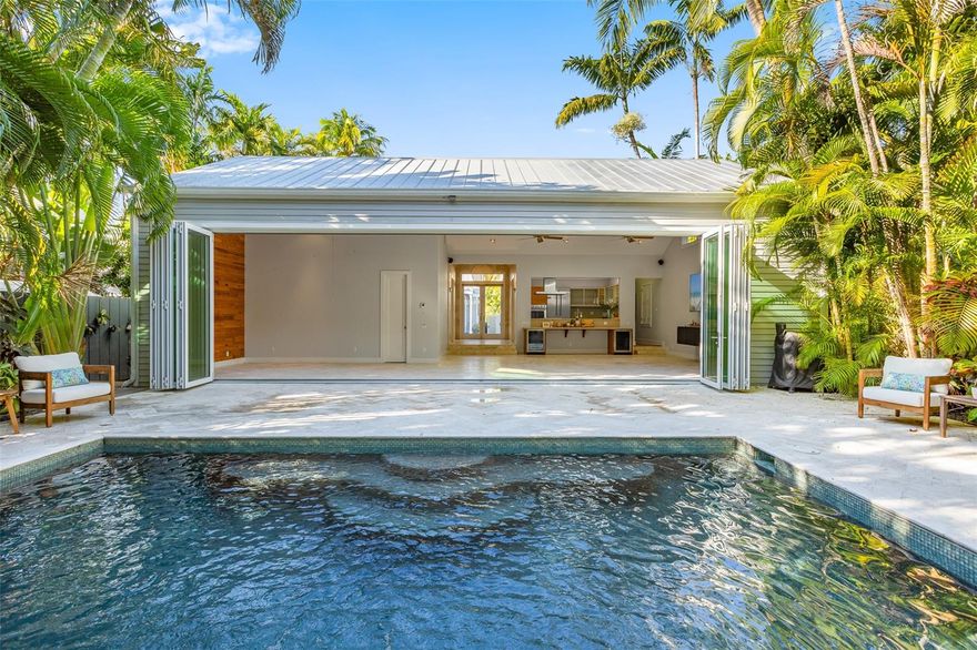 Old Town compound consisting of a beautiful Great House, two bedroom and two and a half bathroom main home with two remarkable guest cottages. The main home has been recently crowned with a 40' Nana door system which spans the entire width of the great room and shares a lush, tropically landscaped pool deck with the rear cottage. The master bedroom is large with French doors and a incredible bathroom. The second bedroom also has an en-suite bathroom. The front 3 room guest house has cathedral ceilings through out. The bathroom walls are covered with incredible Czechoslovakian iridescent green glass made in the 1950's. A pullman kitchen also is part of front guest house. A second smaller Guest Cottage is located at the back end of the property with new doors and windows. A private porch provides sitting space where you can watch the pool or the goings-on in the main house. This is a private space for the lucky duo who get to use this special space. The extra bedroom has a sitting area and dining area plus high vaulted ceiling. This cottage has another special bathroom and an outdoor shower. 
it is the view out onto the garden and pool that make this little retreat so neat. The compound is incredibly spacious with luxurious bathrooms and multiple outdoor spaces and two off-street parking spots on Fleming. Totaling 4 bdrms/4.5 baths including 2 guest houses. Upgrades include a generator, privacy wall & gate, sprinkler system, hurricane shutters, landscaping, & much more!