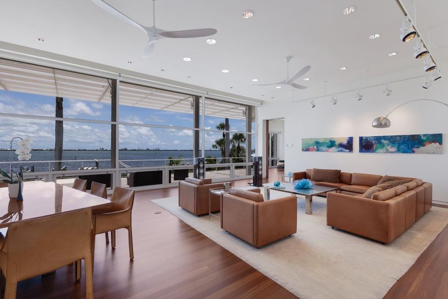 PENDING TAKING BACK UP OFFERS. A Masterpiece of Coastal Luxury and Engineering Excellence. Designed by acclaimed Chicago architect Howard Holtzman and masterfully executed by BCB Homes of Naples, this exceptional estate represents the pinnacle of timeless design and coastal resilience. Set against a backdrop of breathtaking sunsets over Little Gasparilla Island and the Gulf. 
 
Crafted with concrete and steel for enduring strength and peace of mind, the home blends elegant architecture with advanced engineering. Walls of impact-rated glass open to elevated terraces, a vanishing-edge pool, raised spa, and lush tropical landscaping, creating a seamless indoor-outdoor lifestyle just minutes from Boca Grande.
 
*Marine Facility & Waterfront Features *Top-tier deep water dockage for yachts in the 50-foot class *Two additional slips one for boats in the 35-foot class *Private boat lift 7,000lb *Unobstructed views across protected waters of Placida Harbor *Interior Highlights 5 private bedrooms, each with independent outdoor access *5 luxurious bathrooms  *An extraordinary master suite featuring a custom dressing room and expansive walk-in closet * Refinished Brazilian cherry flooring * Designer lighting throughout *Chef’s Kitchen *Custom Varena & Foster stainless steel kitchen *Premium appliances including Sub-Zero, Miele, and Bosch *Extensive Upgrades & Smart Features * New roof and eight new HVAC units * 45kW rooftop generator *Flood mitigation panels across the lower level *droll-down hurricane shutters covering custom impact rated windows and doors *Raised pool equipment platform for flood resilience *Integrated weather station *Full security system with cameras *Custom furnishings included for a seamless, move-in-ready experience 

Do you possess a taste for uncompromising quality and refined living? If so, this home is the rare gem you’ve been searching for. A true masterpiece in both design and function, it offers everything you need to elevate your lifestyle to the highest standards.
 
This estate is more than just a home; it's a reflection of success—an unparalleled retreat that blends world-class craftsmanship, breathtaking natural beauty, and the finest amenities. It's not just where you live, it’s how you live. And here, every detail has been thoughtfully curated to meet your discerning tastes. With the private Coral Creek airport just 5 minutes away, it's easy to pop in for a private look. Contact me today.