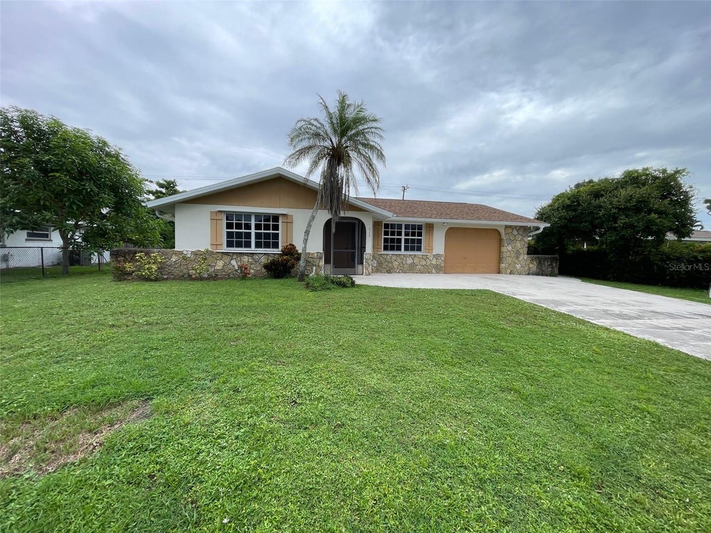 Photo of 517 Skylark Lane NW, Port Charlotte, FL 33952 (MLS # C7531308)